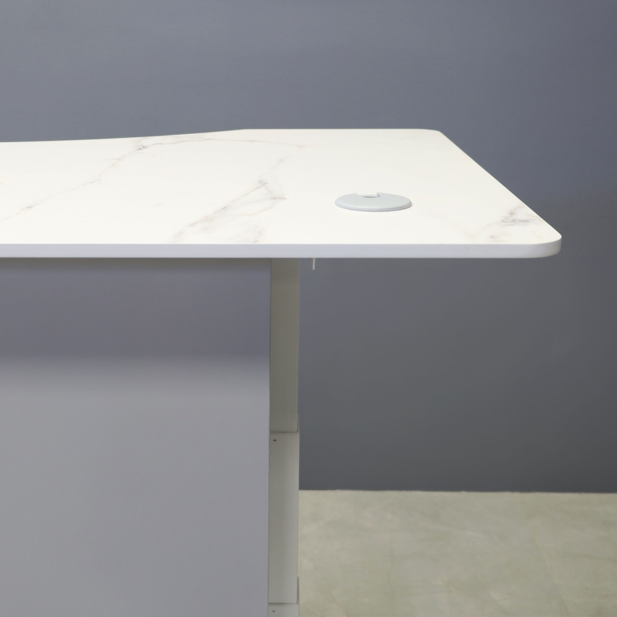 60-inch aXis Sit-stand Executive Desk in 1/2-inch solenne marble engineered surface top, folkstone matte laminate privacy panel and white metal base finish.