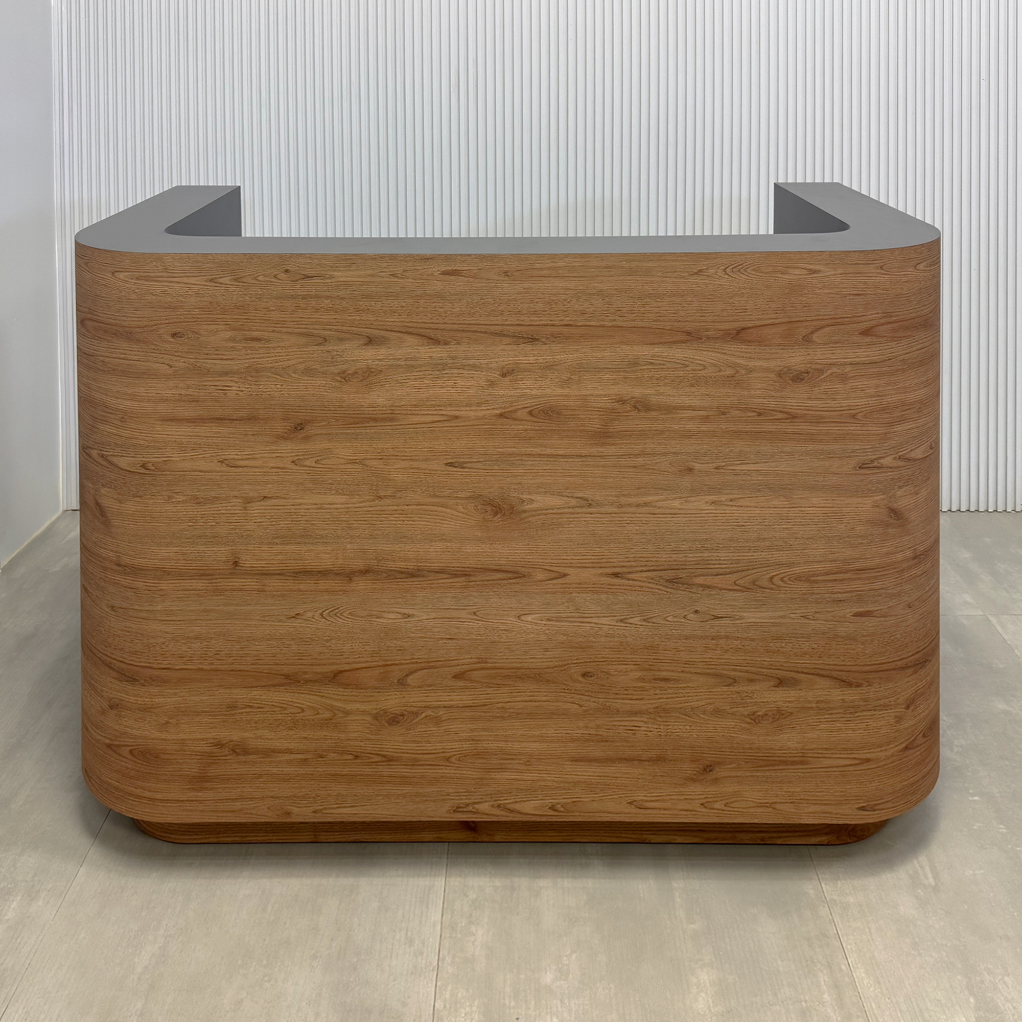 60-inch Nola U Reception Desk with spiced chestnut matte laminate front, storm gray matte laminate workspace, spiced chestnut matte laminate toe-kick, and White LED.
