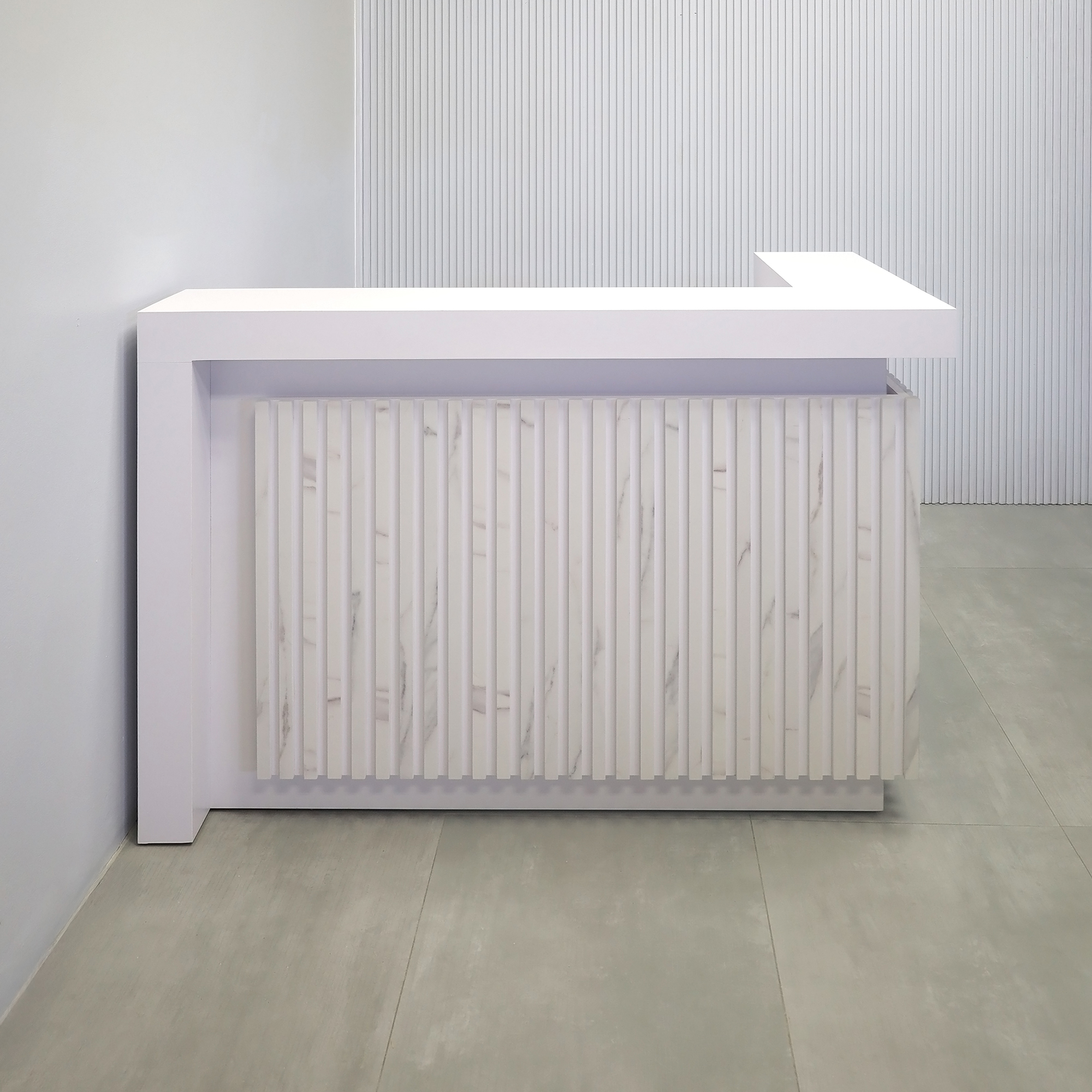 60-inch New York L-Shape Reception Desk with White Matte laminate counter, White Matte laminate workspace, White Matte laminate accent panel, Solenne Marble slats, and Color LED.
