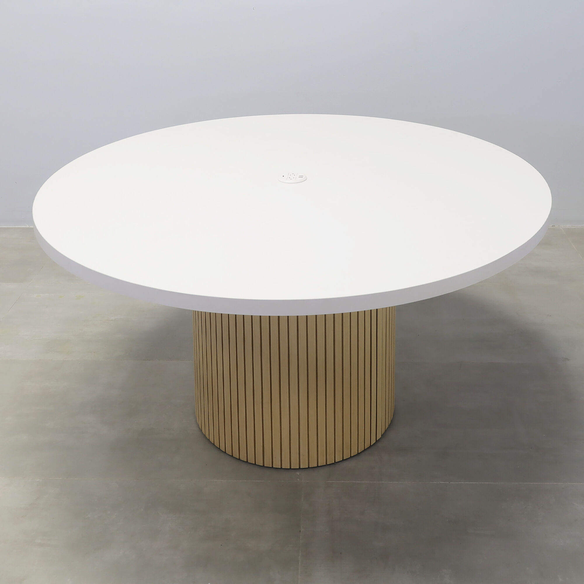 60-inch Newton Round Conference Table with white matte laminate top, maple tambour base, Mx1 in white power box.