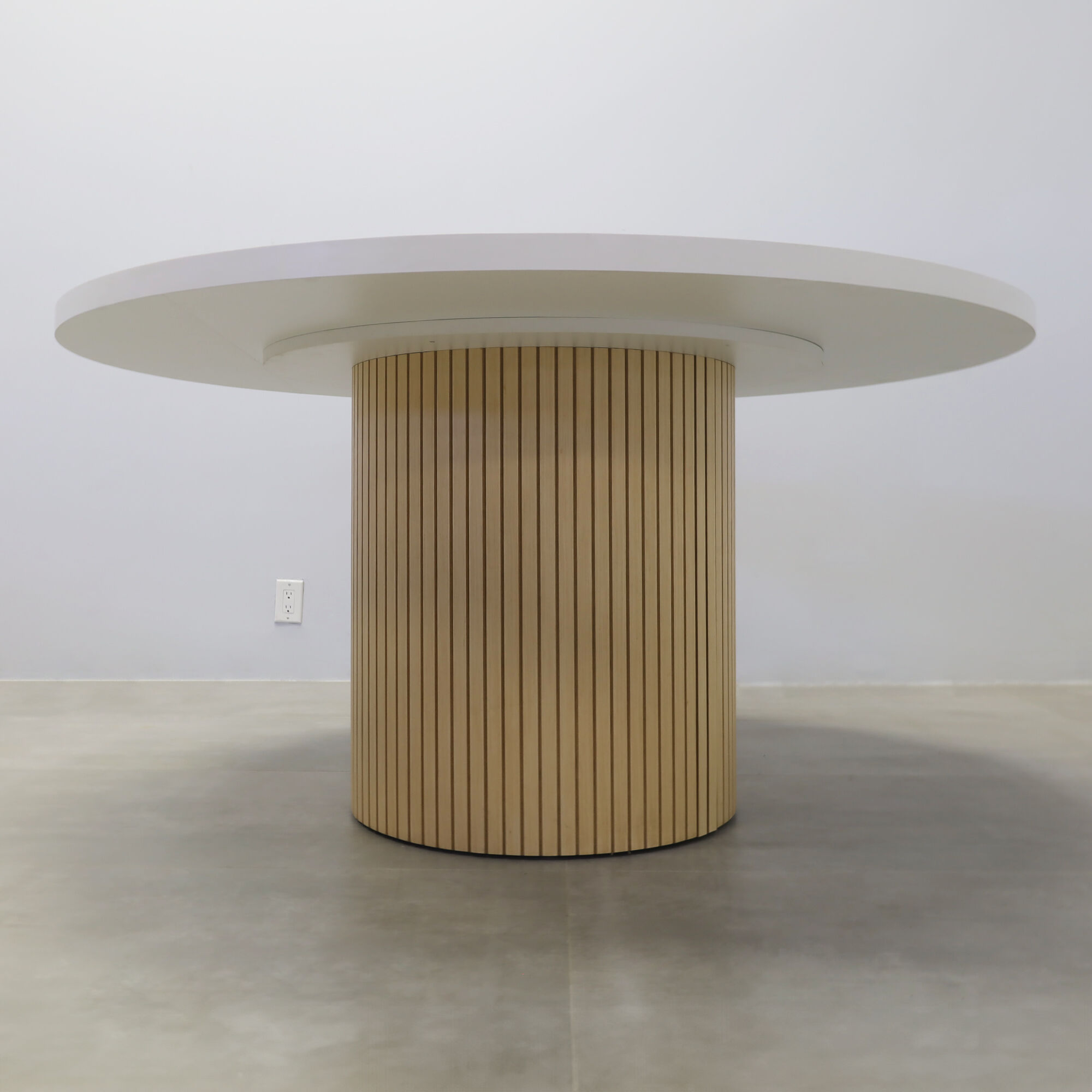 60-inch Newton Round Conference Table with white matte laminate top, maple tambour base, Mx1 in white power box.