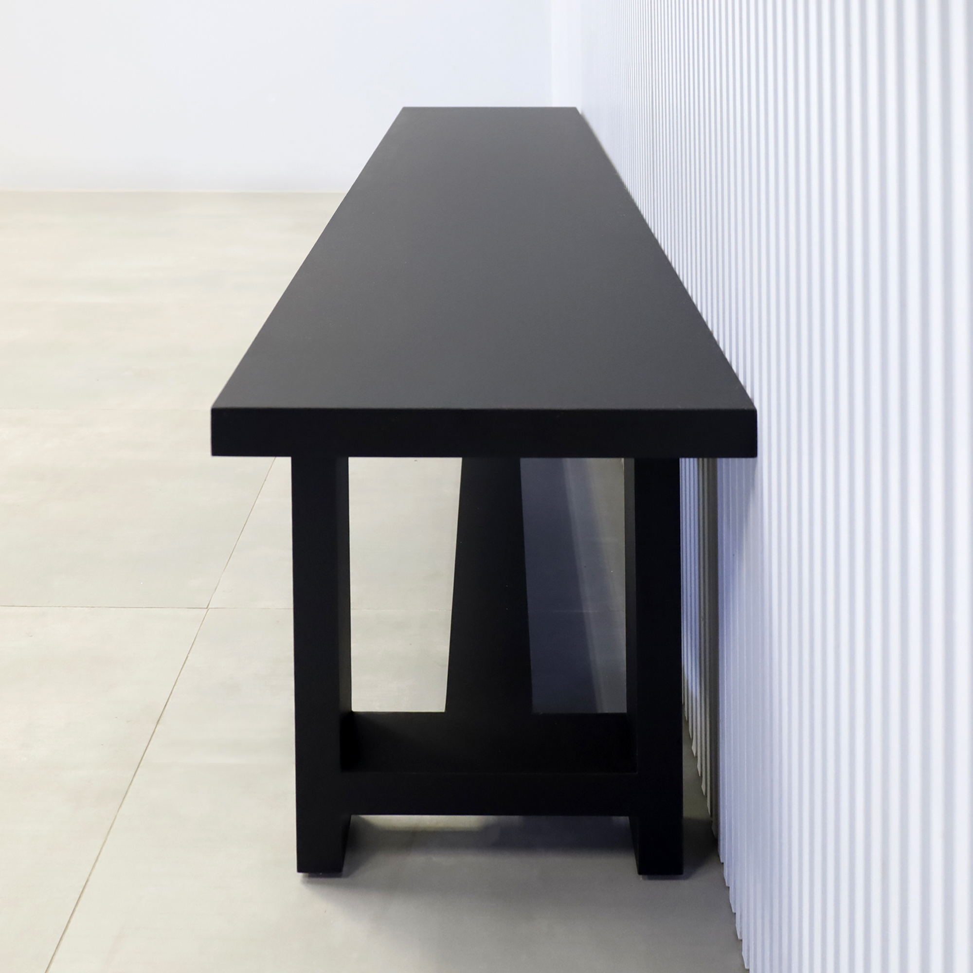 68-inch Charlotte Custom Bench in black traceless laminate seat and black traceless laminate base.