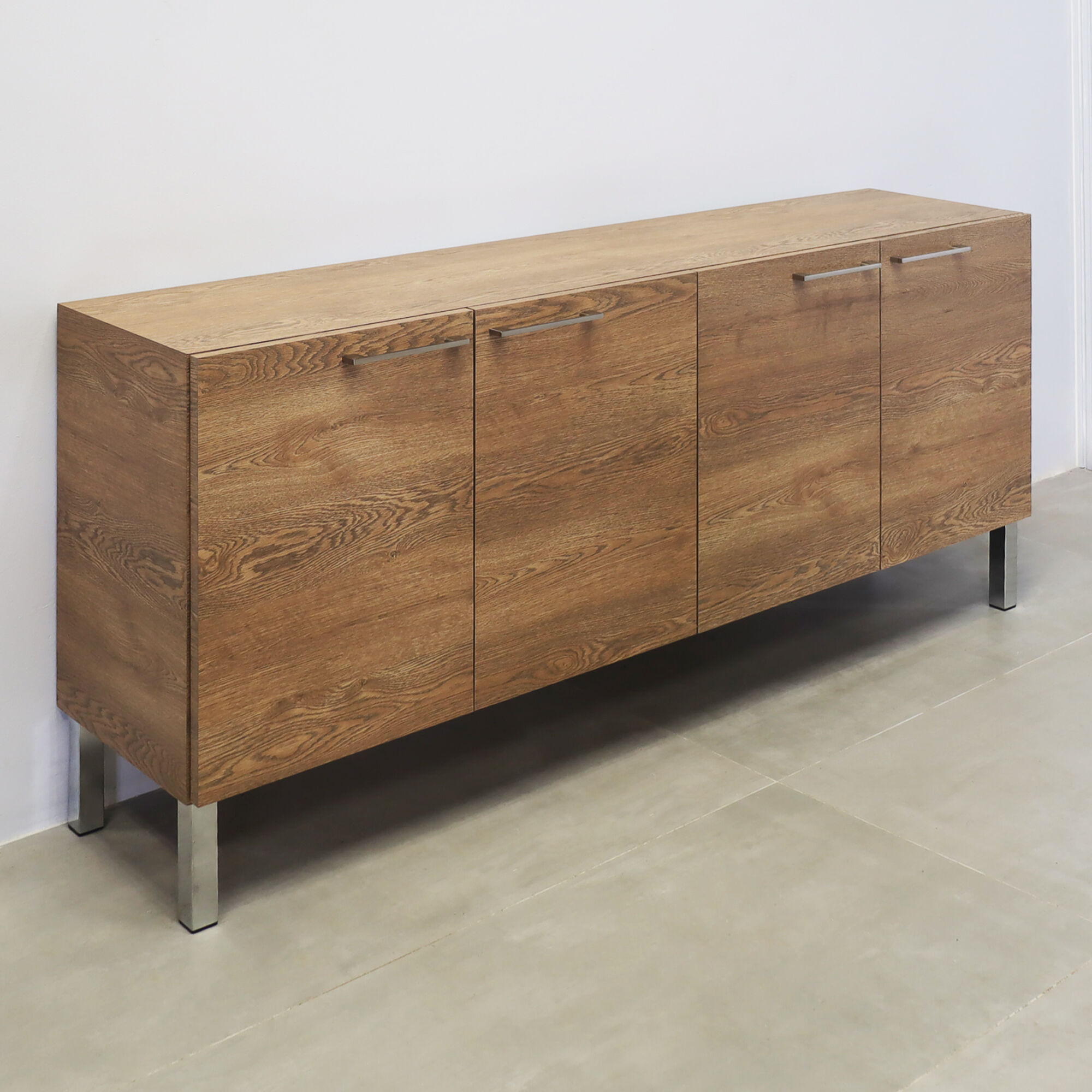 69 ½-inch Naples Custom Storage Credenza with fisher oak laminate credenza & doors, and metal legs.