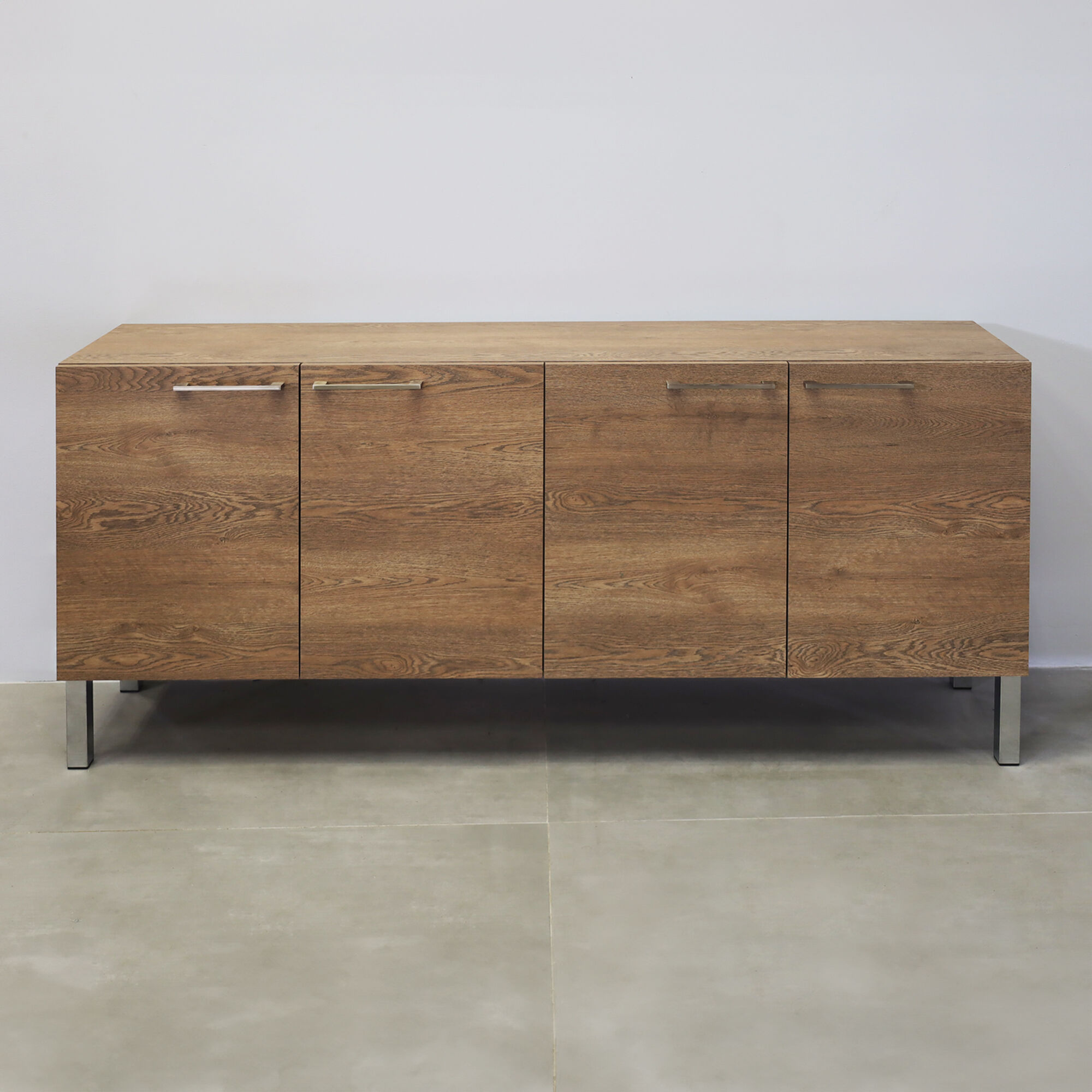 69 ½-inch Naples Custom Storage Credenza with fisher oak laminate credenza & doors, and metal legs.