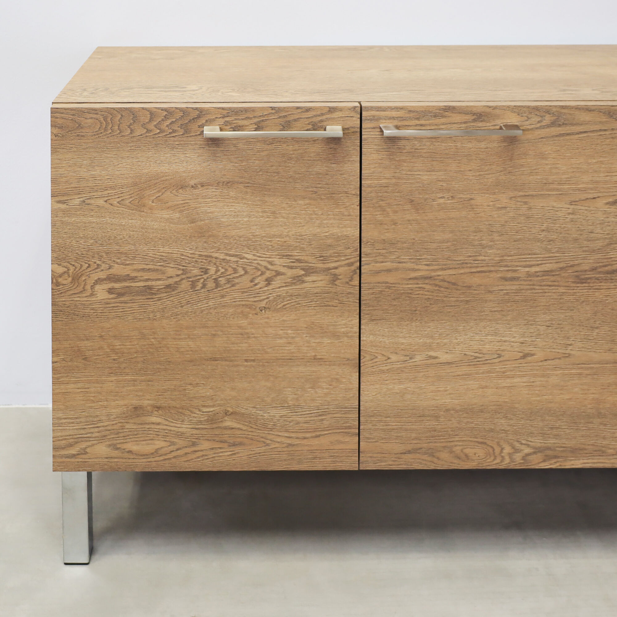 69 ½-inch Naples Custom Storage Credenza with fisher oak laminate credenza & doors, and metal legs.