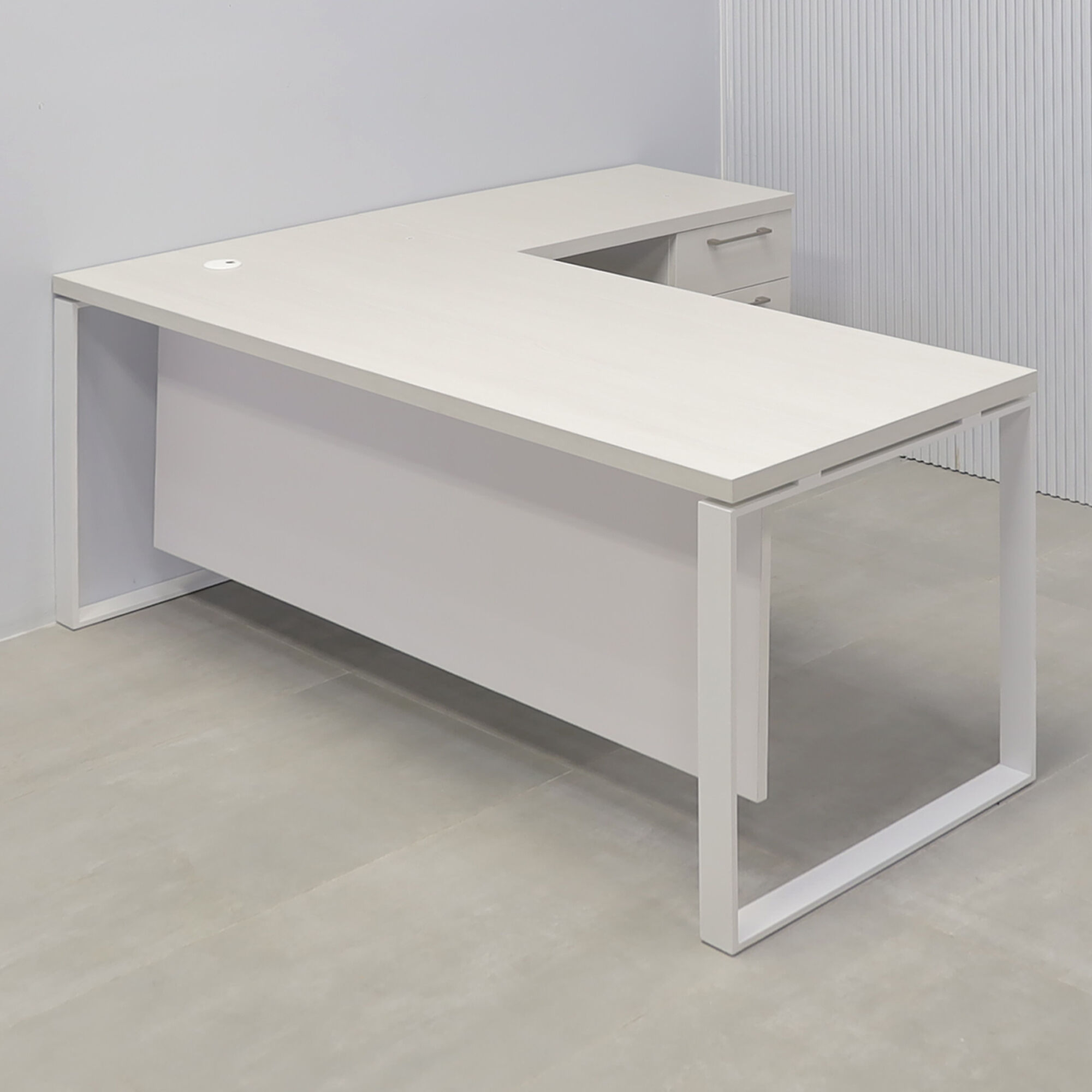 70x65-inch Aspen L-Shape Executive Desk in white ash laminate top, white powder coated metal legs, dover off-white laminate privacy panel, white ash laminate credenza.