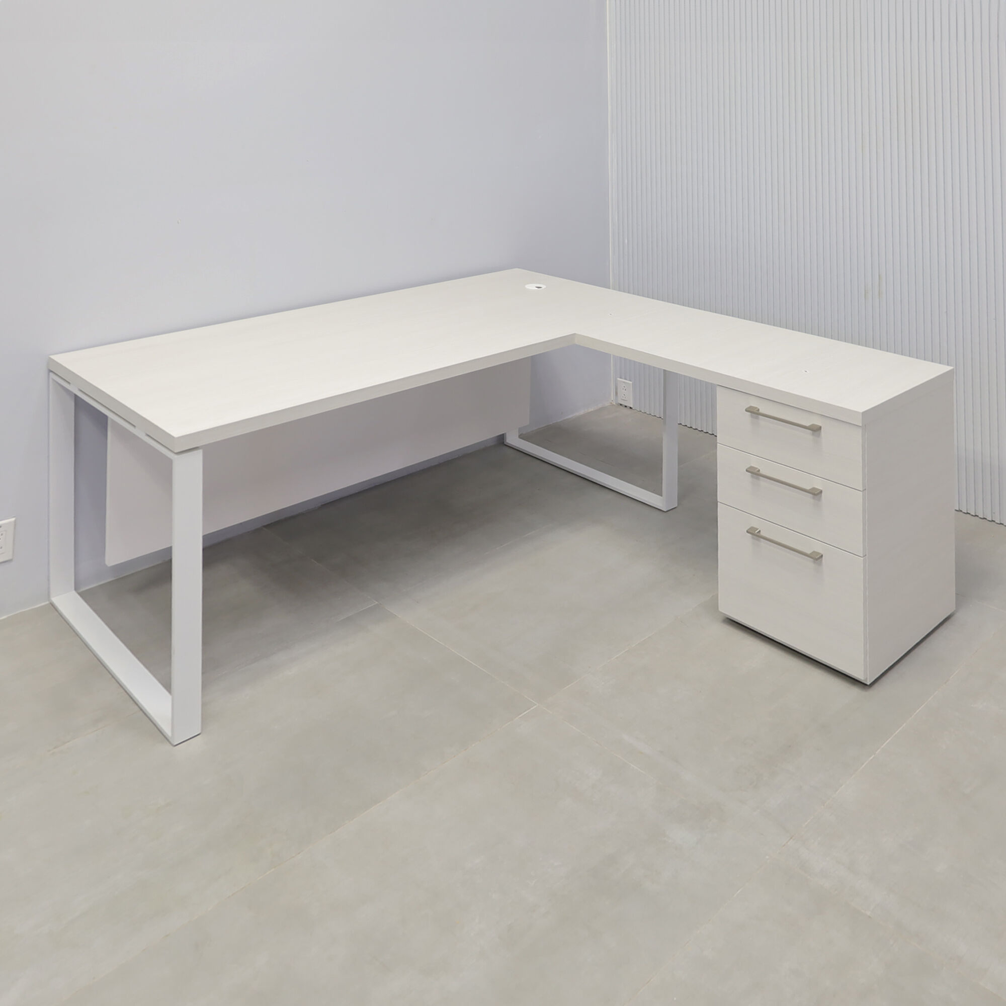 70x65-inch Aspen L-Shape Executive Desk in white ash laminate top, white powder coated metal legs, dover off-white laminate privacy panel, white ash laminate credenza.