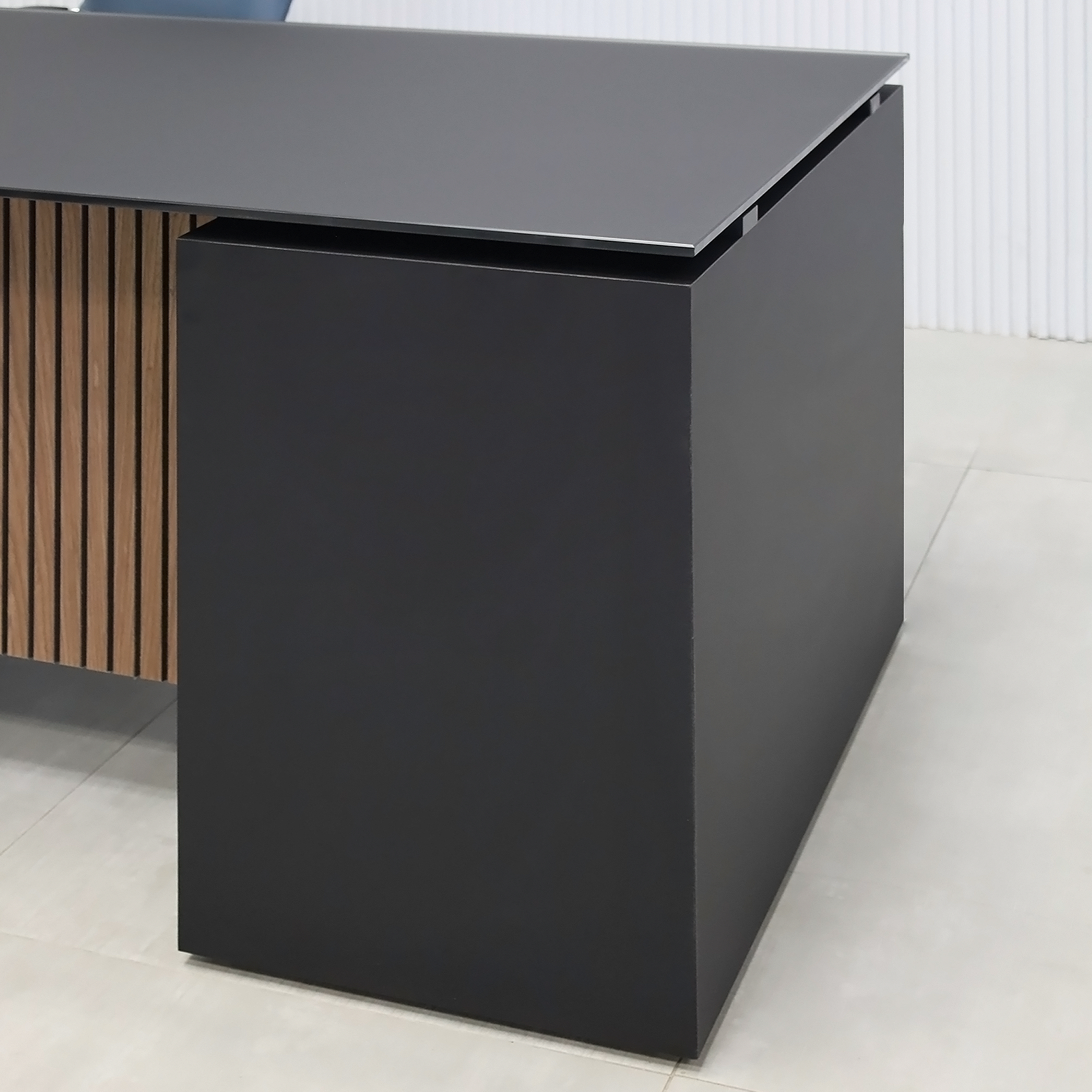 72-inch Denver Straight Executive Desk with 1/2 Satin Black Glass top, Black Traceless laminate base & cabinet, and American Walnut & Black background tambour privacy panel.