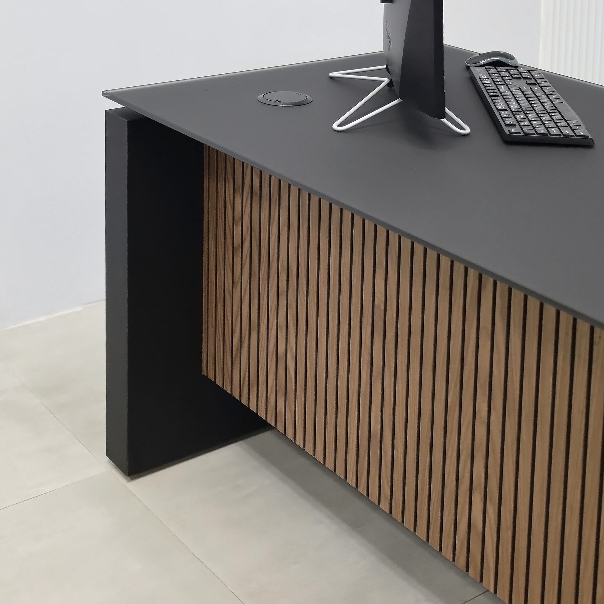 72-inch Denver Straight Executive Desk with 1/2 Satin Black Glass top, Black Traceless laminate base & cabinet, and American Walnut & Black background tambour privacy panel.