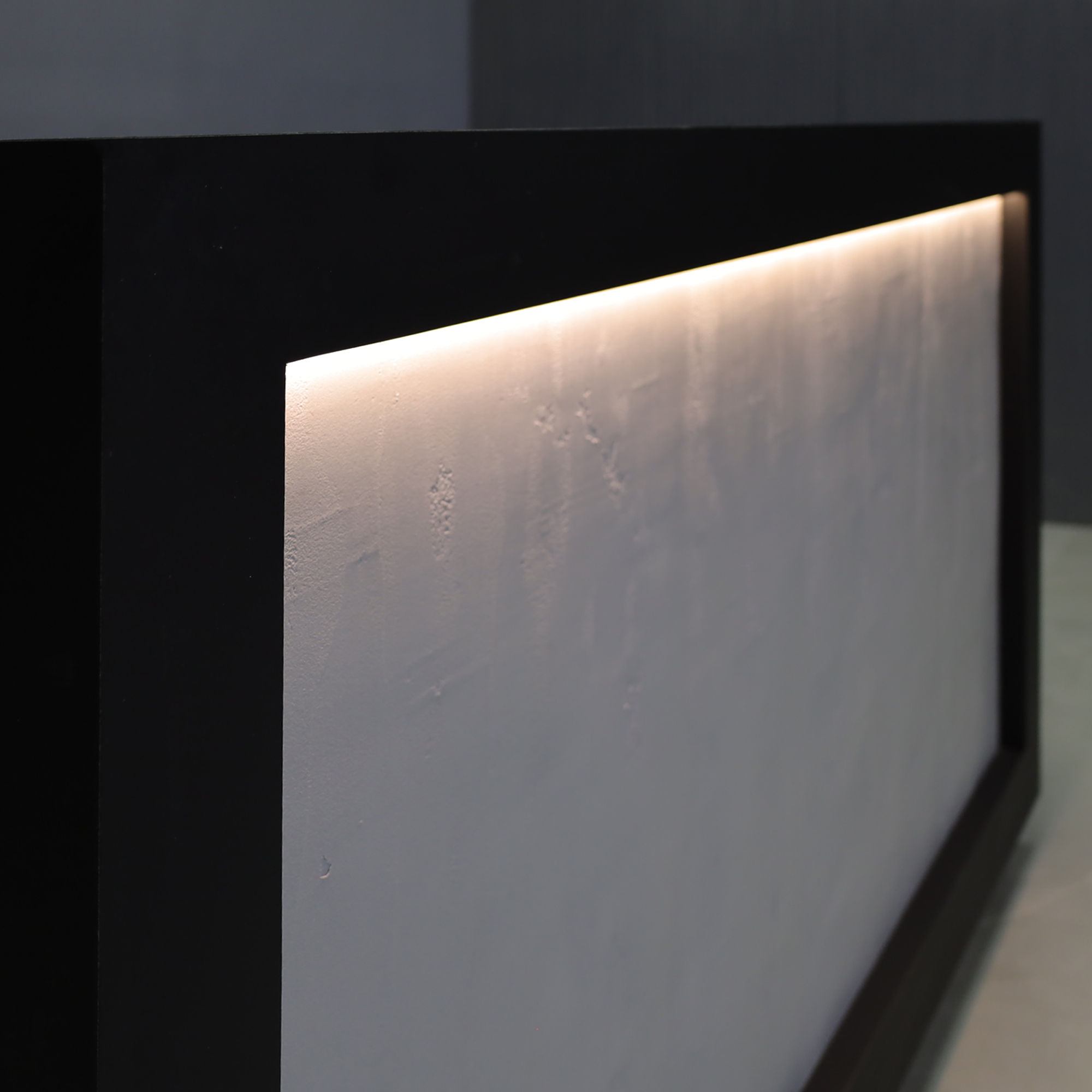 72-inch Vegas Designer Custom Reception Desk with Black Traceless laminate main desk. Concrete Front Accent and White LED.