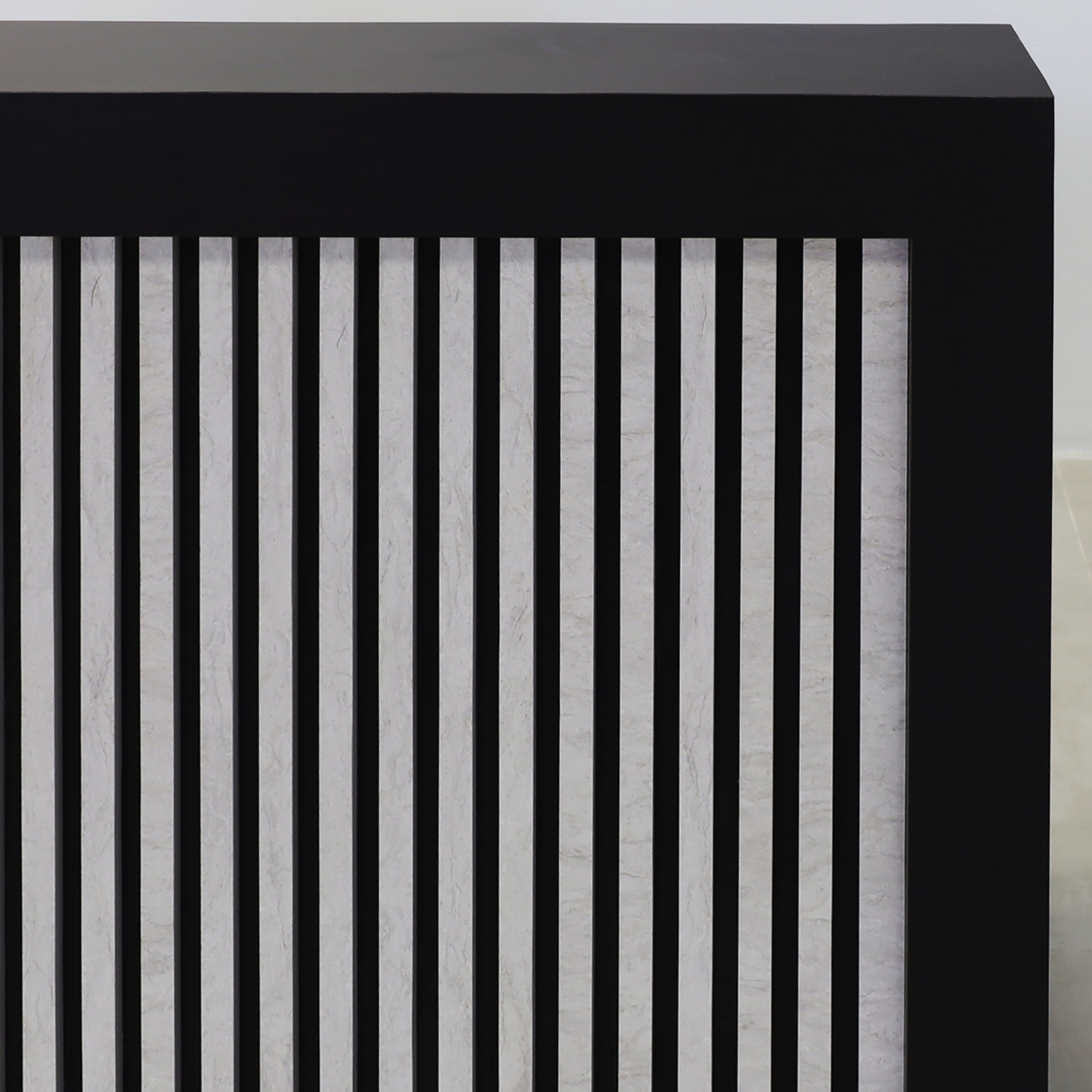 72-inch Vegas Designer Custom reception Desk with Black Traceless laminate main desk. Spanish Limestone slats front panel, warm white LED.