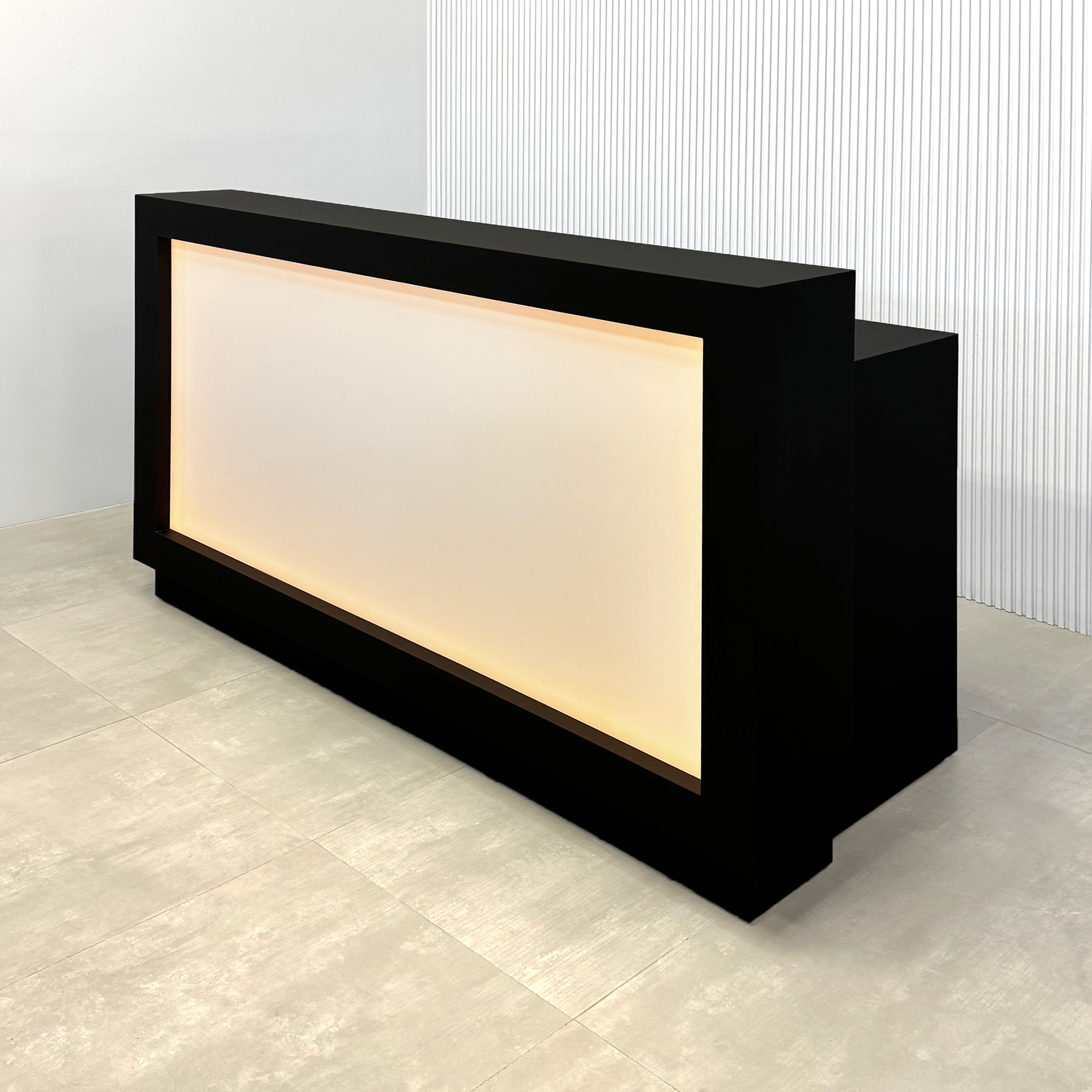 72-inch Vegas Custom Reception Desk with Light Box in black traceless laminate workspace, featuring a black traceless laminate desk and black traceless laminate toe-kick.