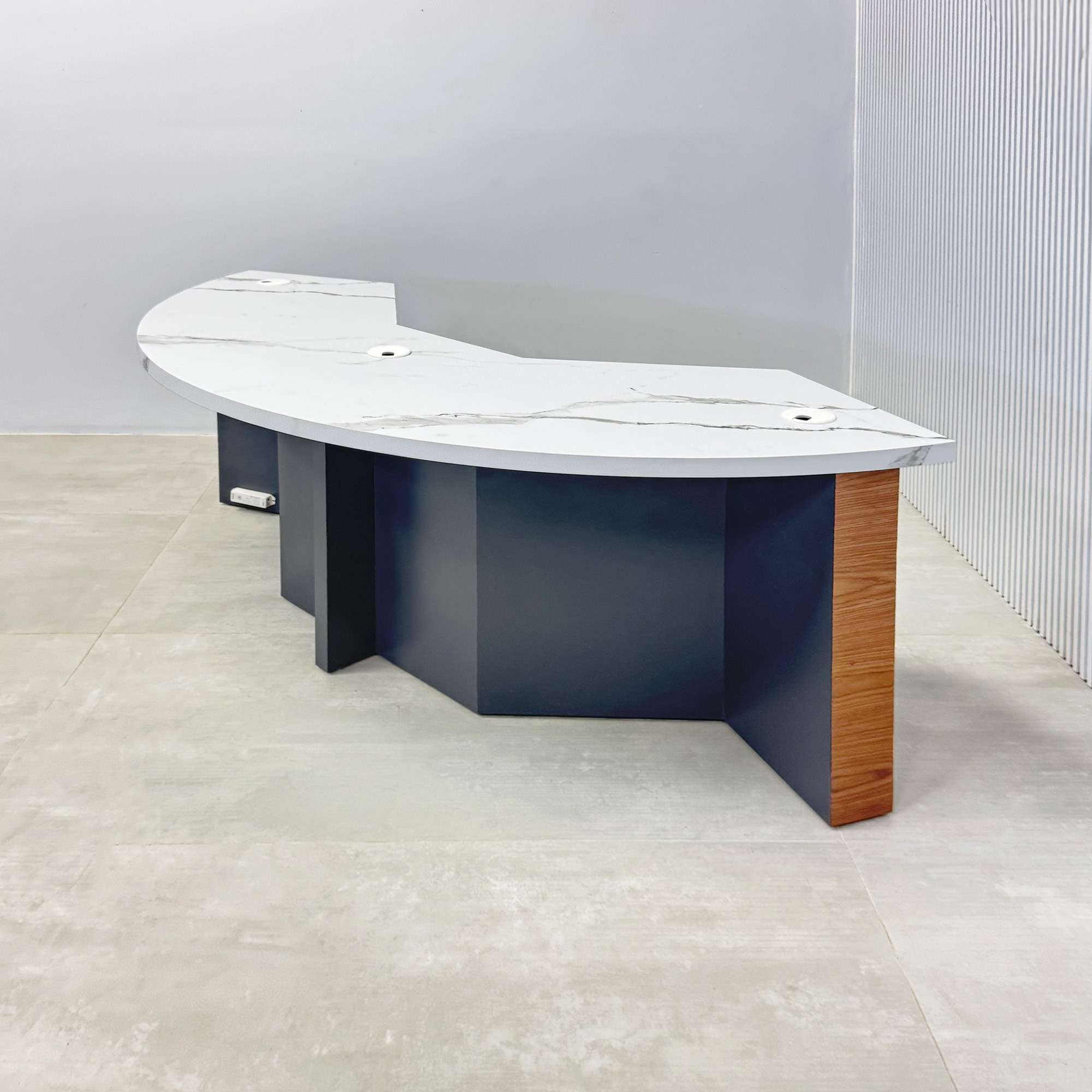 72-inch Tampa Bay Custom Handmade Podcast Table with calcutta stone PVC laminate top, walnut wood veneer front of the base, storm gray matte laminate back of the base, and white warm LED.