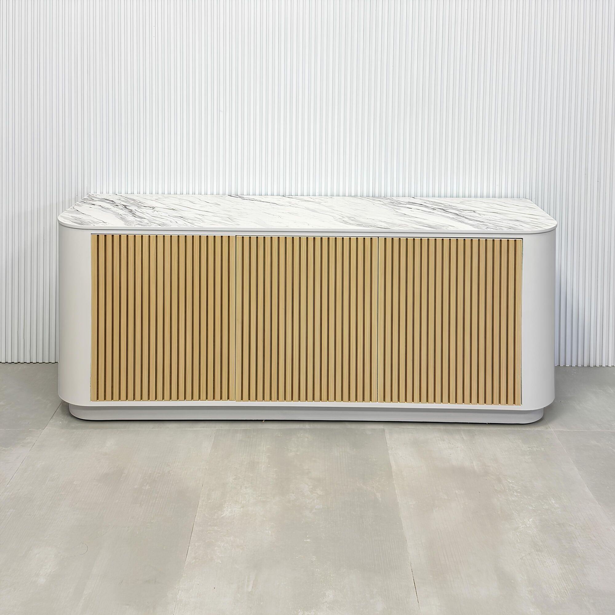 72-inch Florence Storage Credenza with 1/2 Calcutta engineered surface top, dover off white laminate credenza inside, and maple tambour front doors.