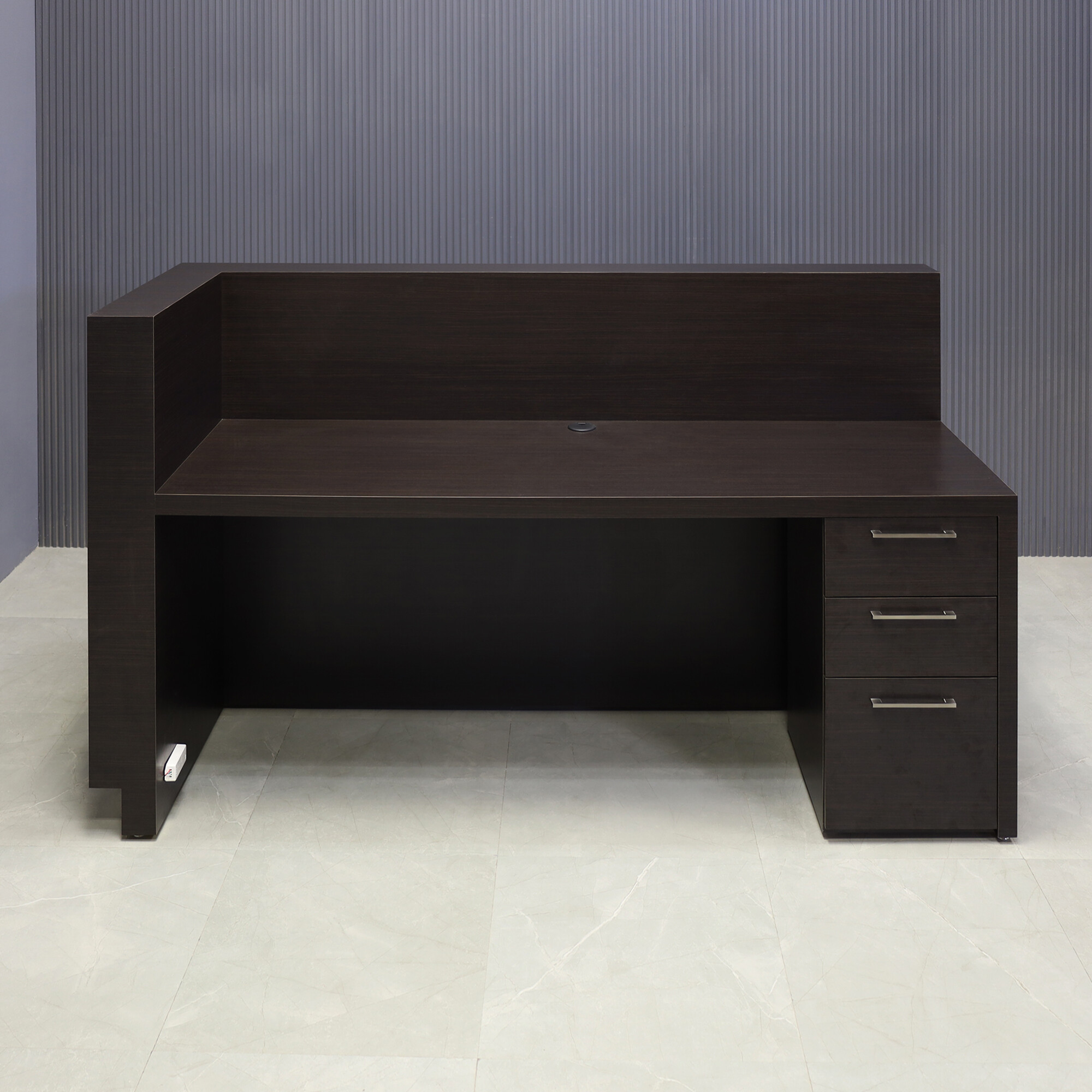 72-inch Dallas L-Shape Custom Reception Desk, right side when facing front in ebony recon matte laminate main desk and gold aluminum toe-kick, with warm white LED, and built-in storage on right side when sitting, shown here.