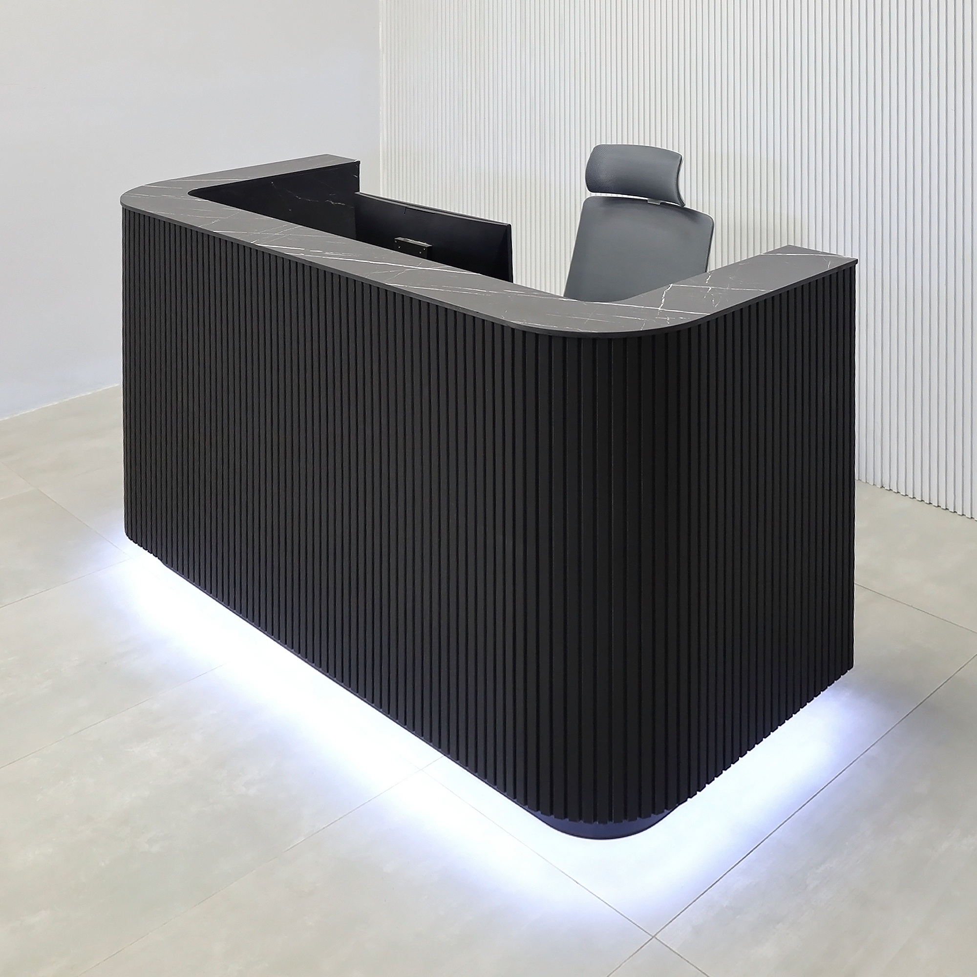 72-inch Nola Reception Desk with Pietra Noir engineered surface countertop, Black Traceless tambour main, Black Stone Palazzo laminate workspace, and Warm White LED.