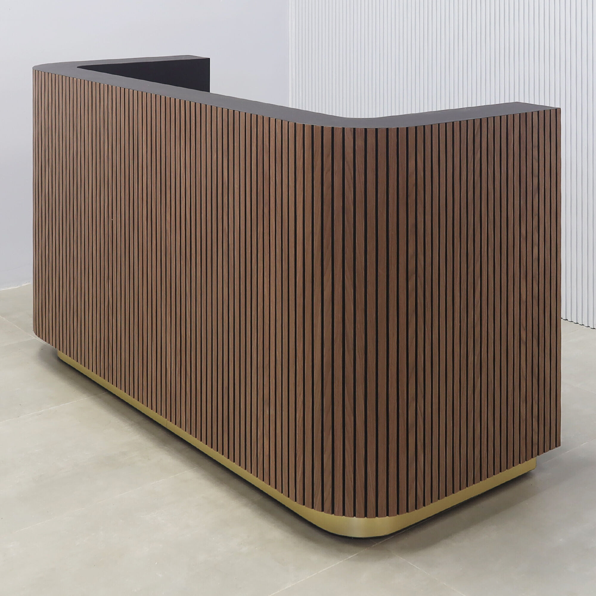 72-inch Nola Reception Desk in walnut tambour with black background front, black traceless laminate workspace, gold aluminum toe-kick.