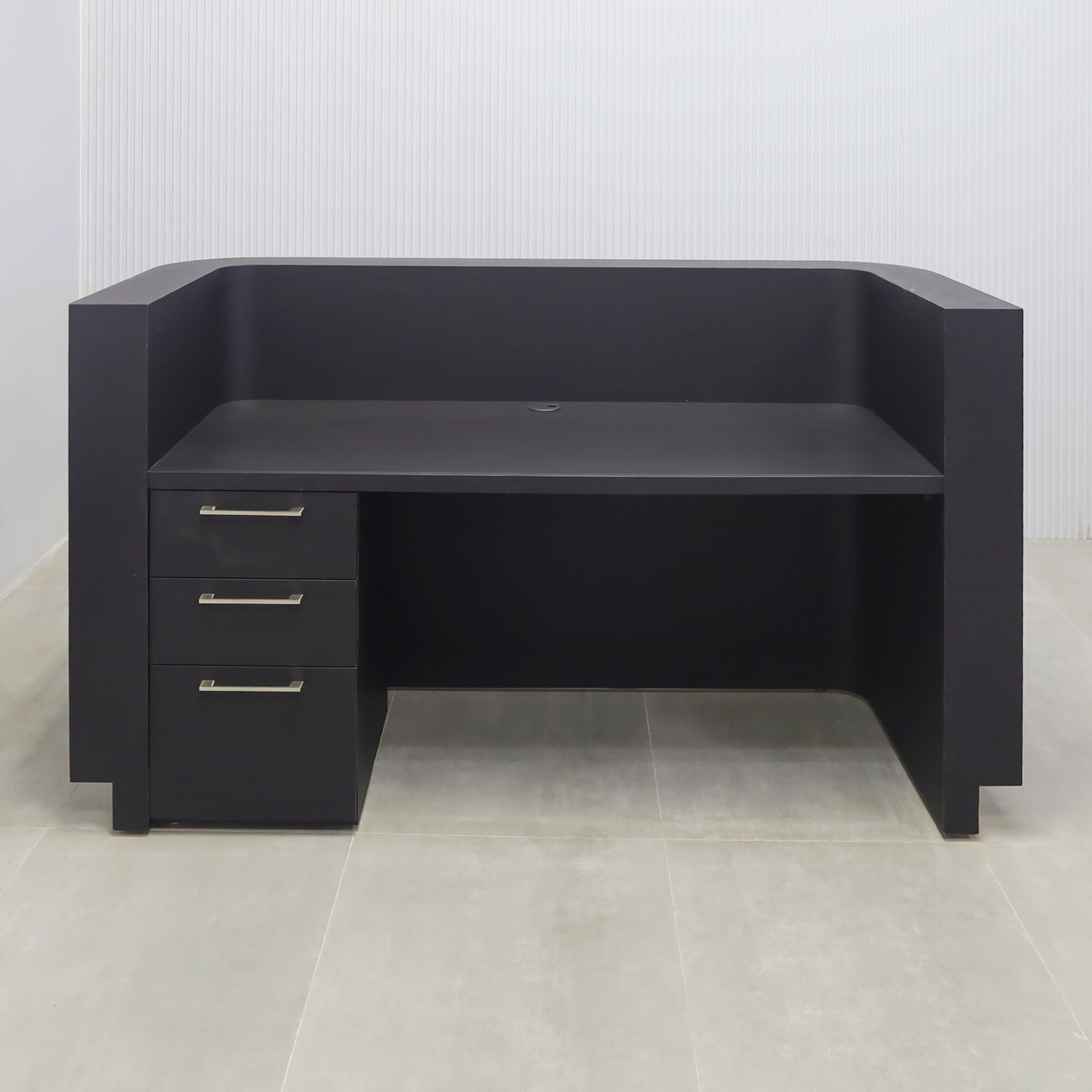72-inch Nola Reception Desk in walnut tambour with black background front, black traceless laminate workspace, gold aluminum toe-kick.