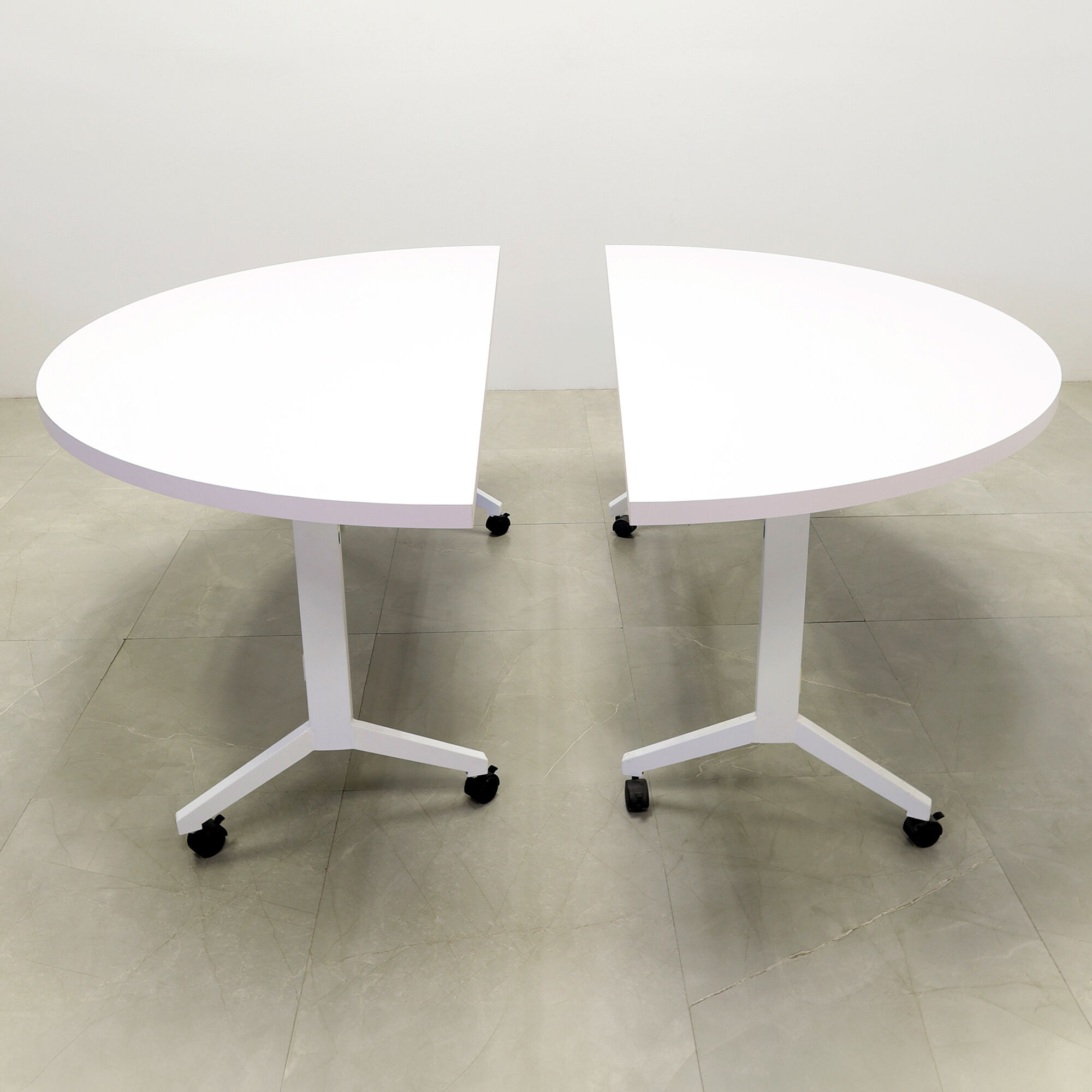 Two 72-inch Westin Half Moon Training Table in white matte laminate top and white metal frame.