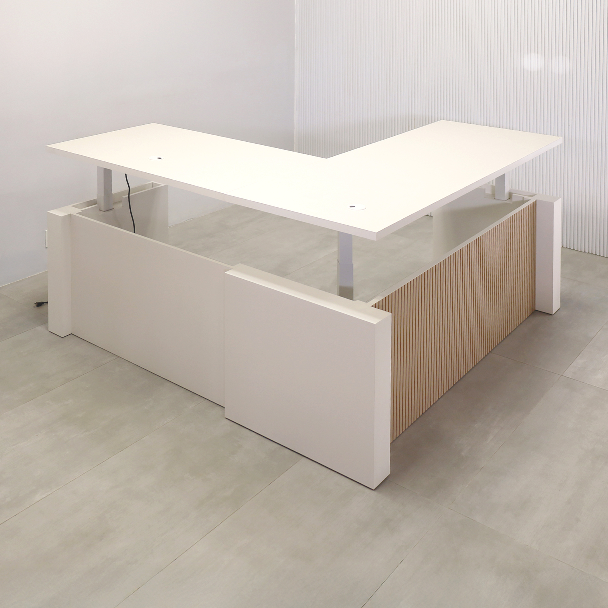 80-inch Denver L-Shape Laminate Executive Desk with Sit-Stand Mechanism with Dover Off-White matte laminate top and base. Washed Oak tambour privacy panel and white base.