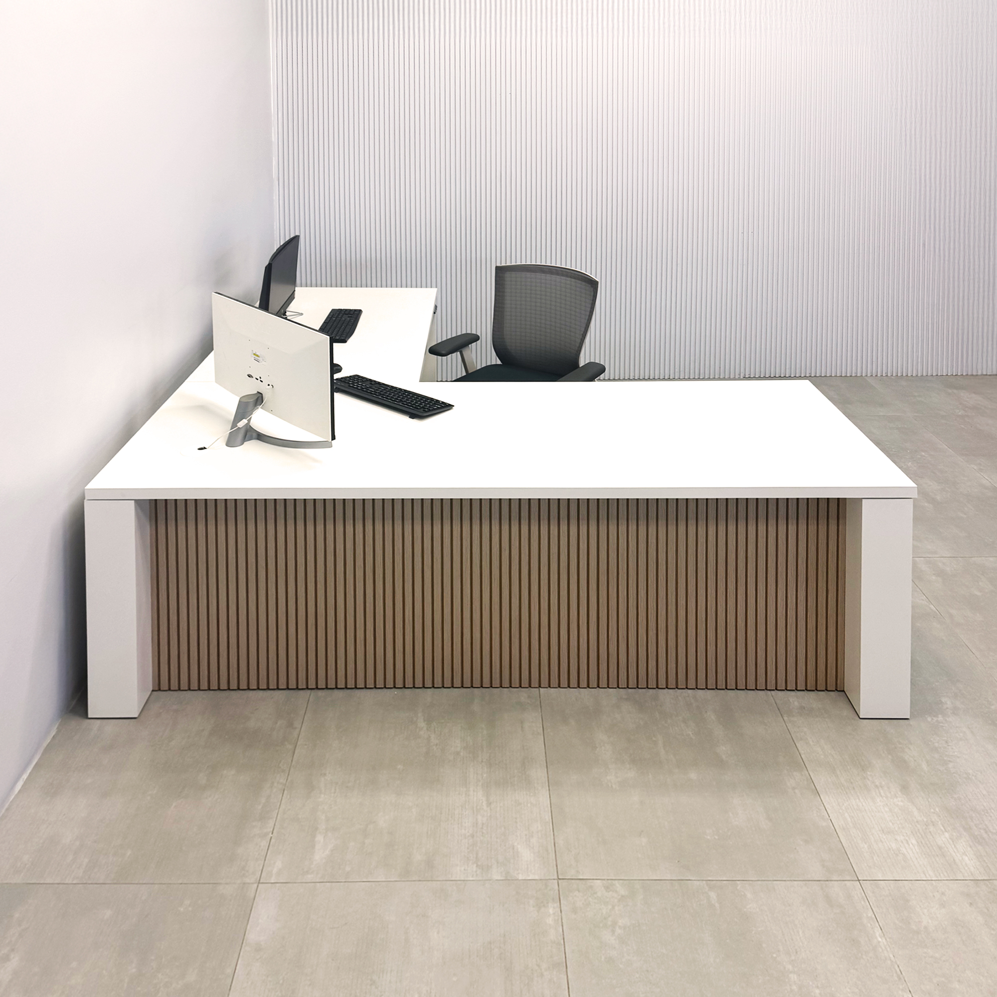 80-inch Denver L-Shape Laminate Executive Desk with Sit-Stand Mechanism with Dover Off-White matte laminate top and base. Washed Oak tambour privacy panel and white base.