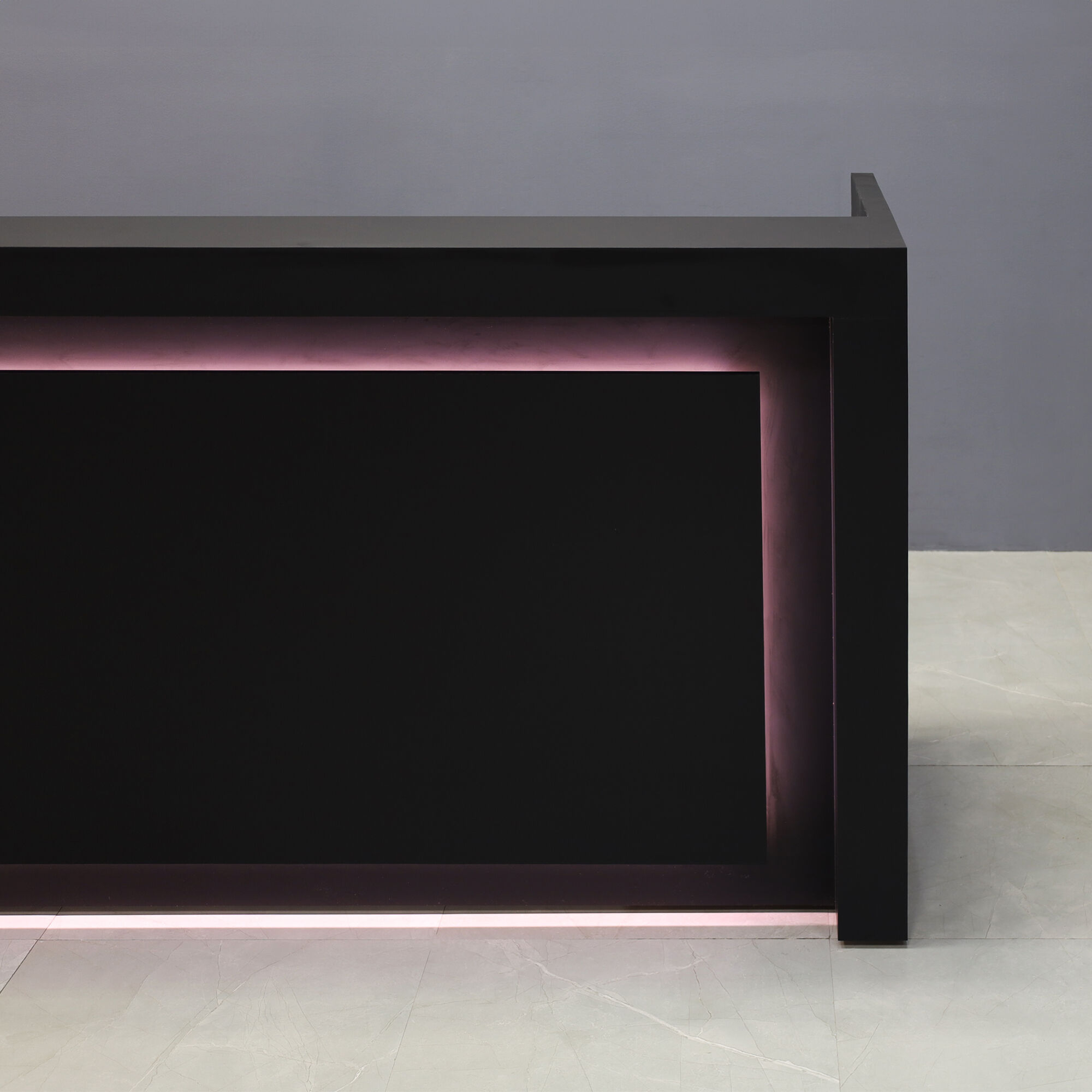 84-inch New York U-Shape Custom Reception Desk in black traceless laminate main desk and accent recess, with warm white LED, shown here.