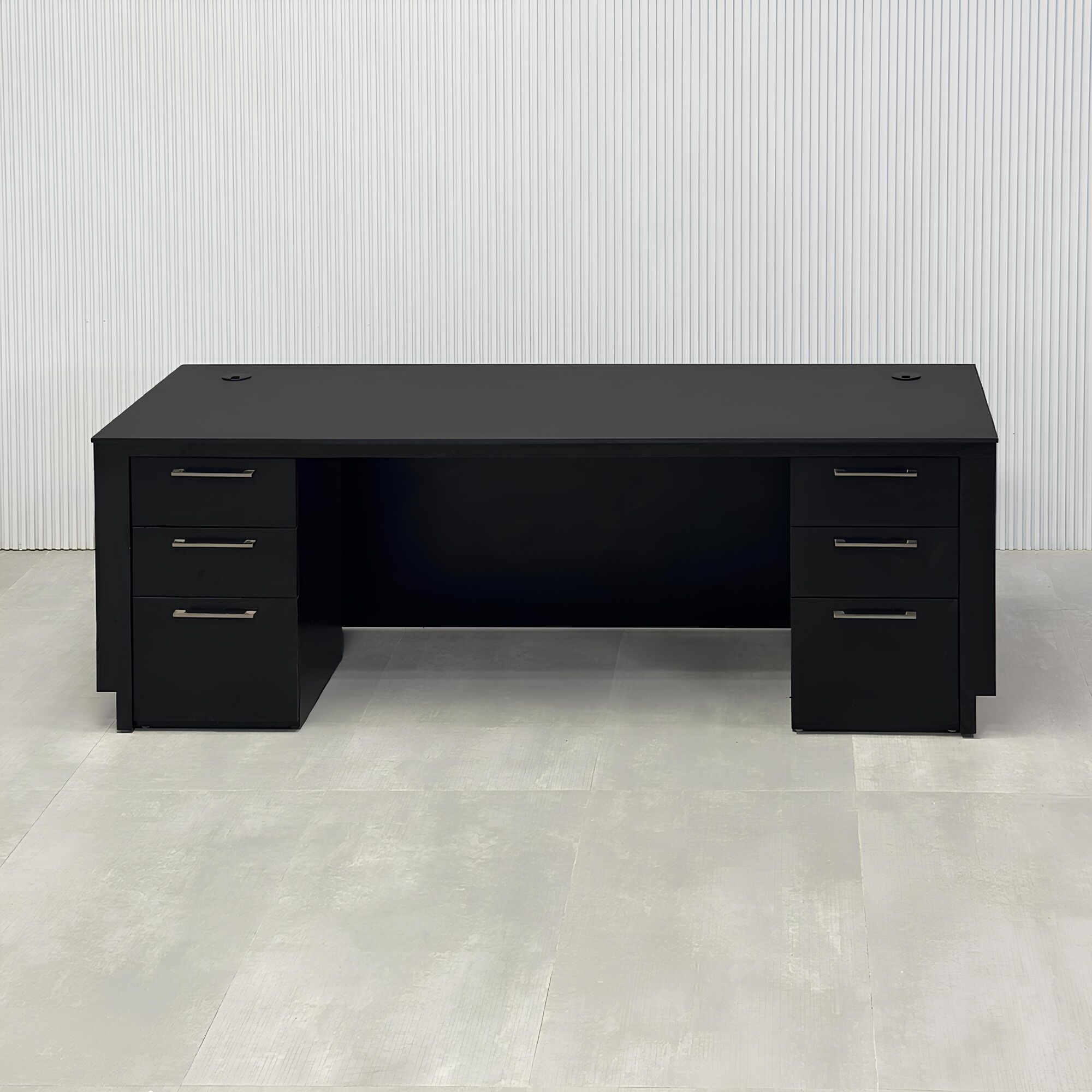 84-inch Houston Executive Desk with 1/2 black traceless engineered surface top, australian walnut tambour with black background front, australian walnut veneer toe-kick and workspace, and white LED.