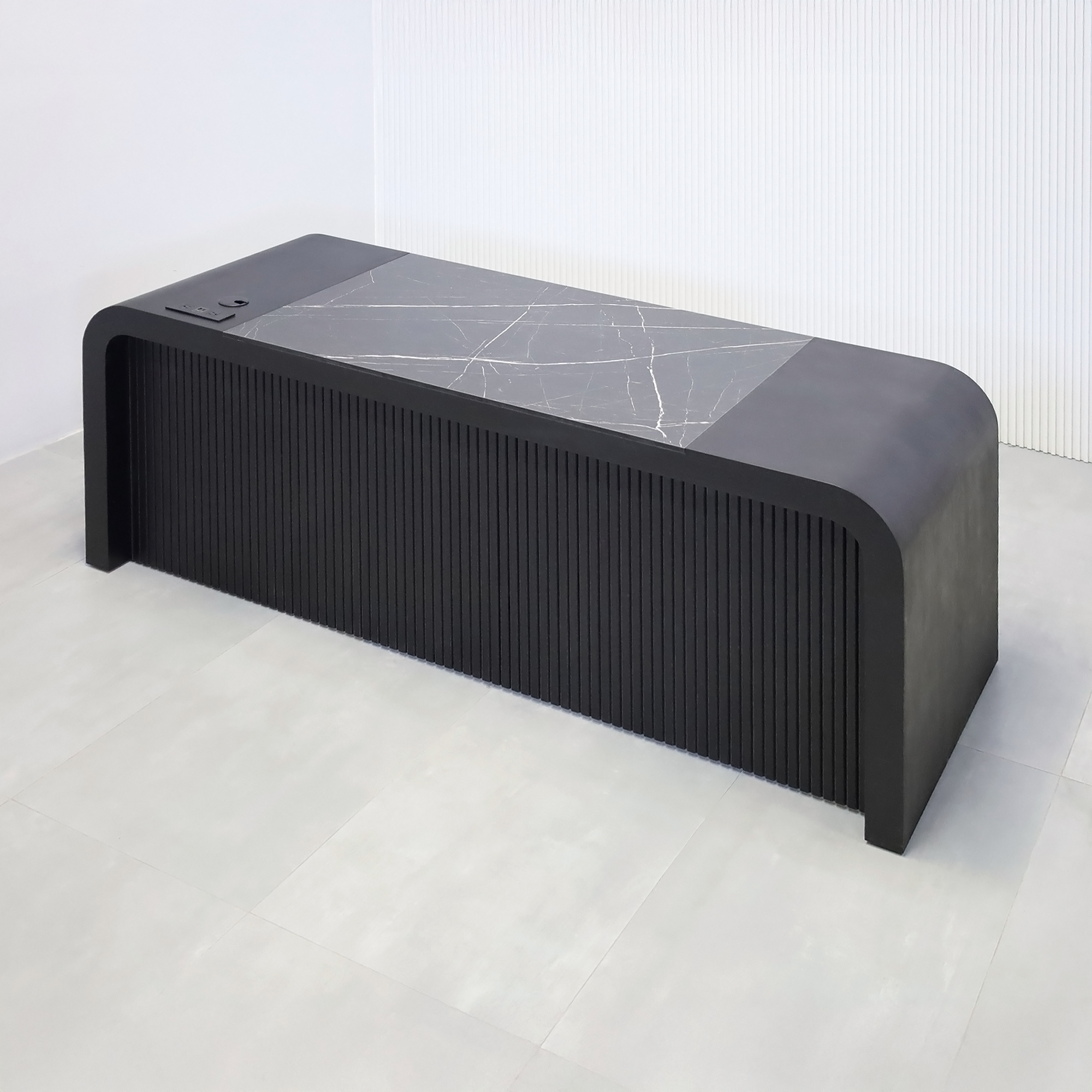 84-inch Milano Executive Desk with Pietra Noir engineered surface top, Black Cinder matte laminate desk, Ebony tambour, and power box in Black.