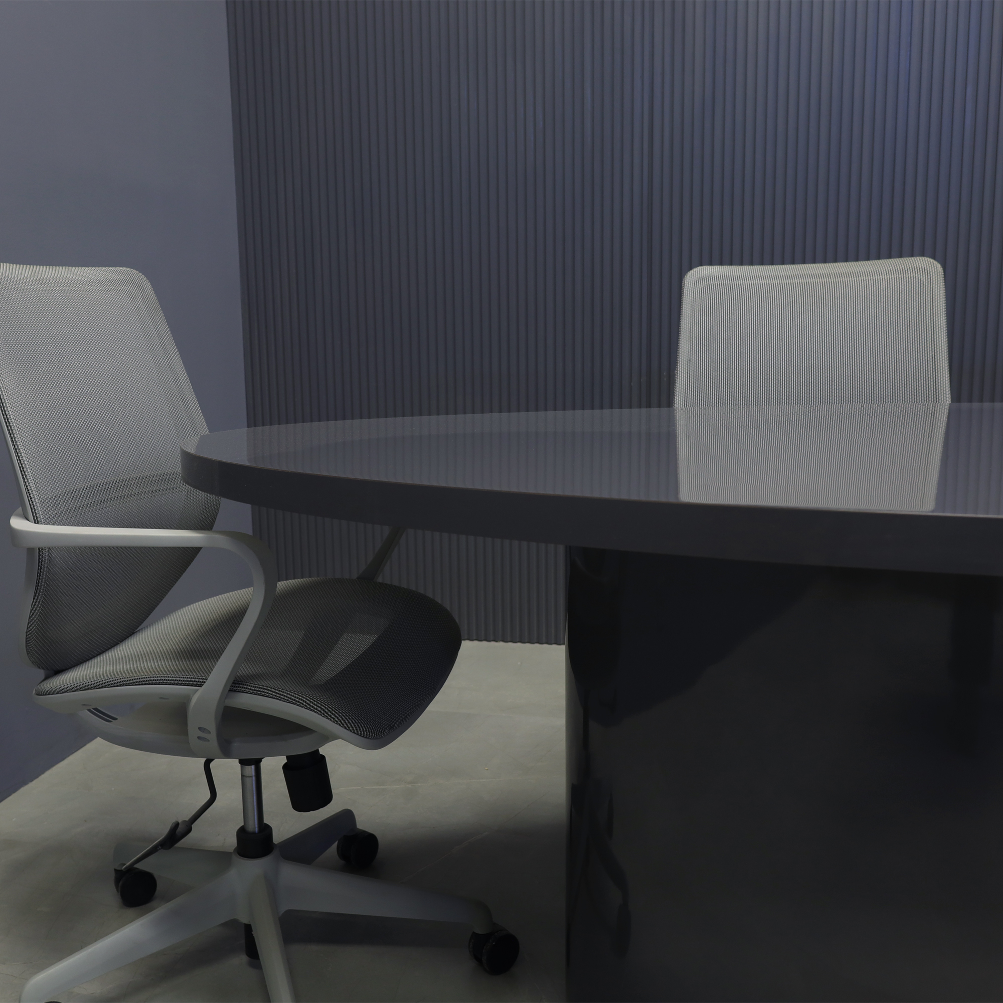 84-inch Newton Oval Conference Table With Laminate Top in storm gray gloss laminate top and base, with silver MX3 powerbox, shown here.