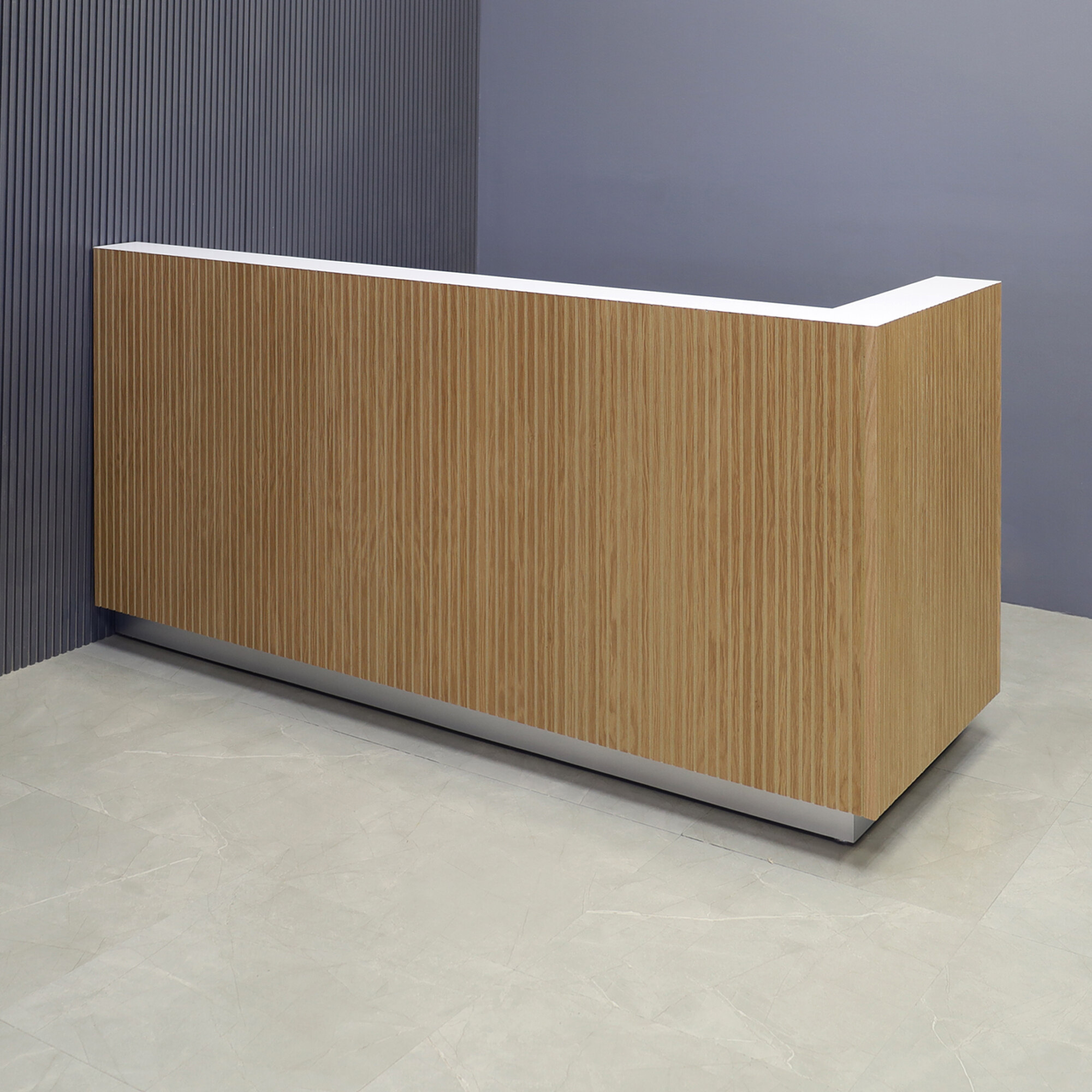 84-inch Dallas L-Shape Custom Reception Desk, right side l-panel when facing front in white oak tambour main desk, and white matte laminate workspace, with brushed aluminum toe-kick, shown here.
