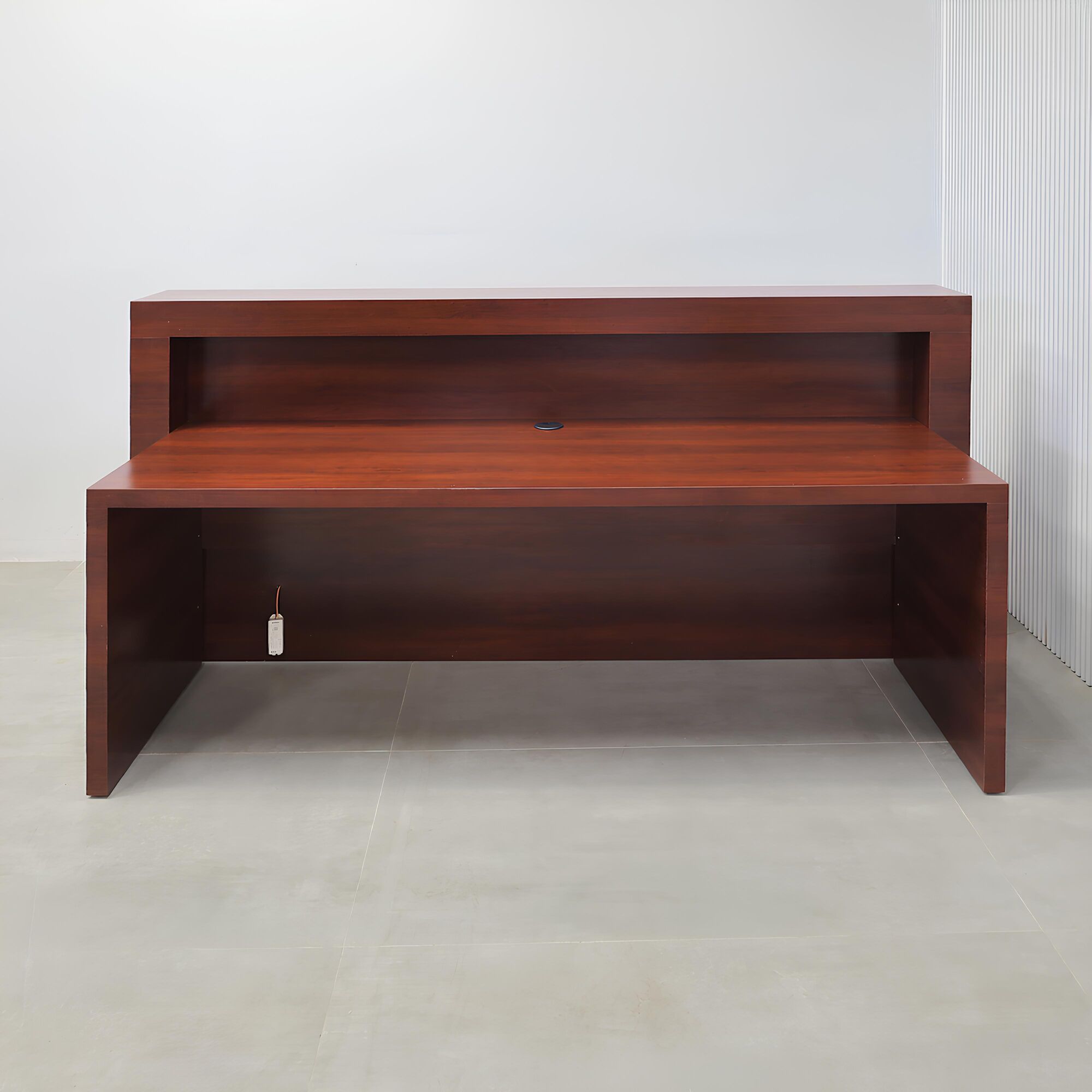 84-inch New York Straight Reception Desk with williamsburg cherry main desk, storm gray matte laminate accent, and white LED.
