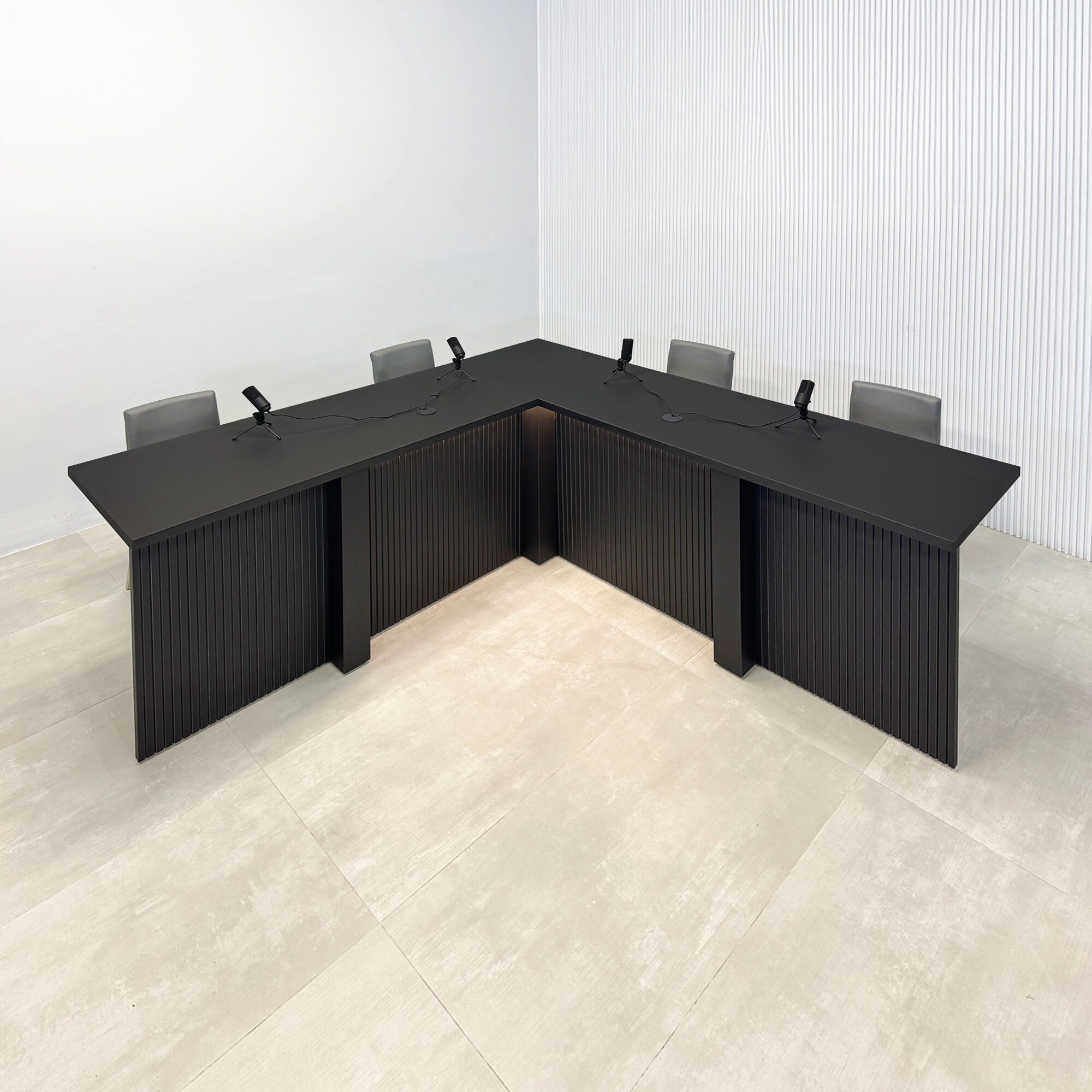 84X84-inch Savannah L Podcast Table with black traceless laminate top, black tambour base, black matte laminate inside finish, white LED included.