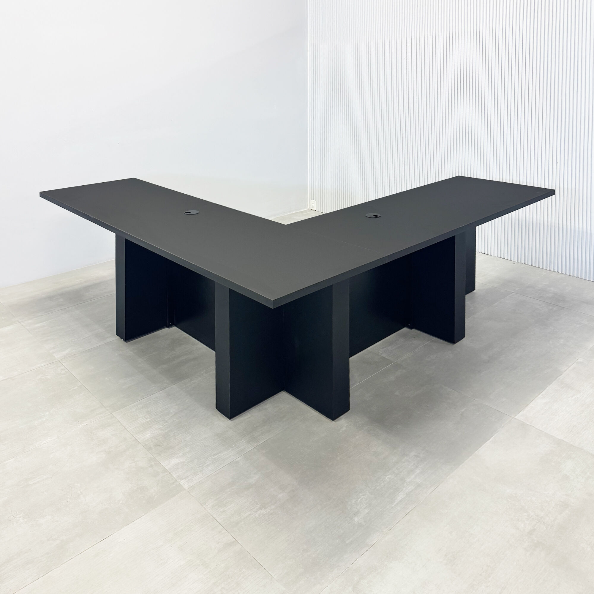 84X84-inch Savannah L Podcast Table with black traceless laminate top, black tambour base, black matte laminate inside finish, white LED included.