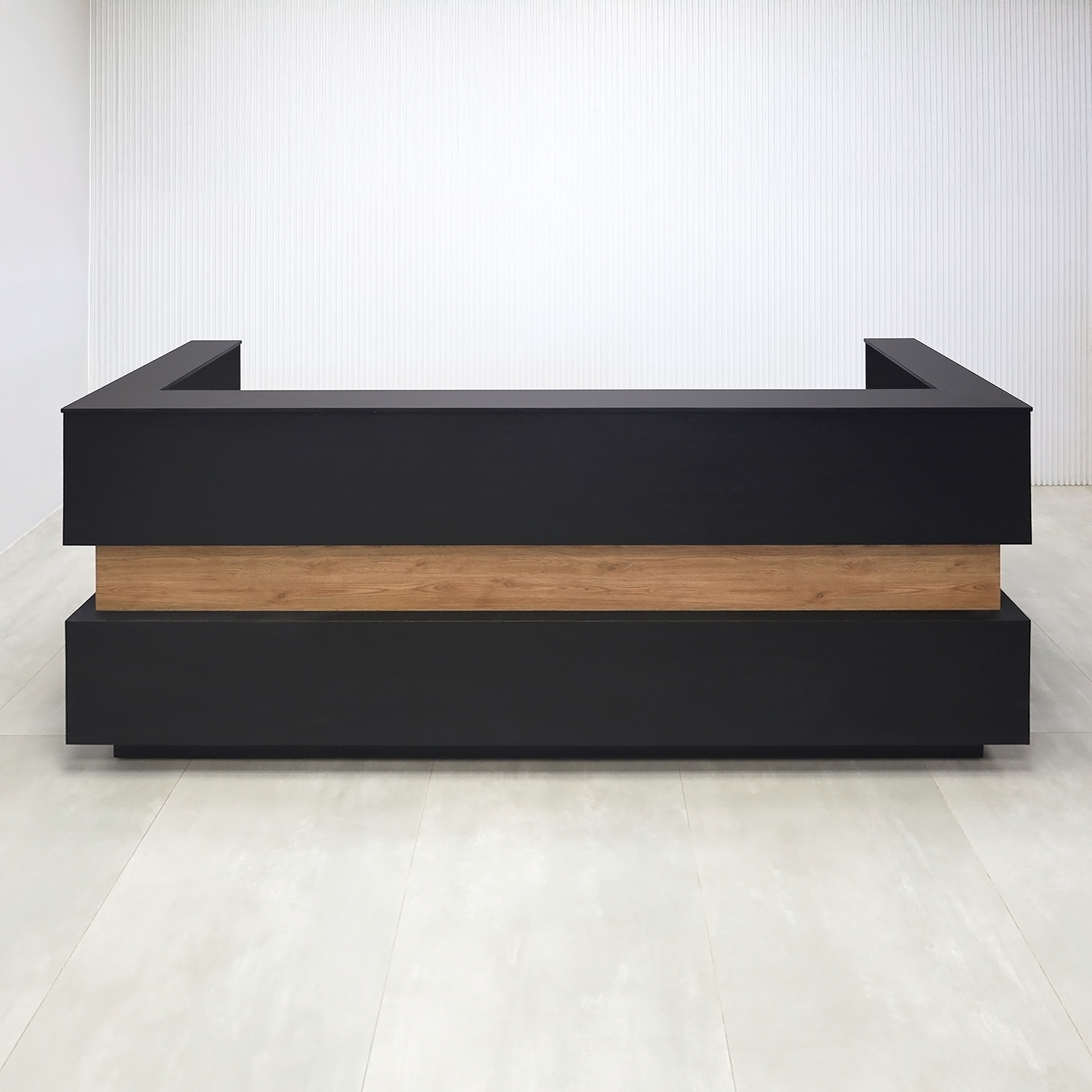 90-inch Pensacola Reception Desk with Black Cinder matte laminate desk and toe-kick. Spiced Chestnut laminate accent, Black traceless engineered surface top, and White LED.