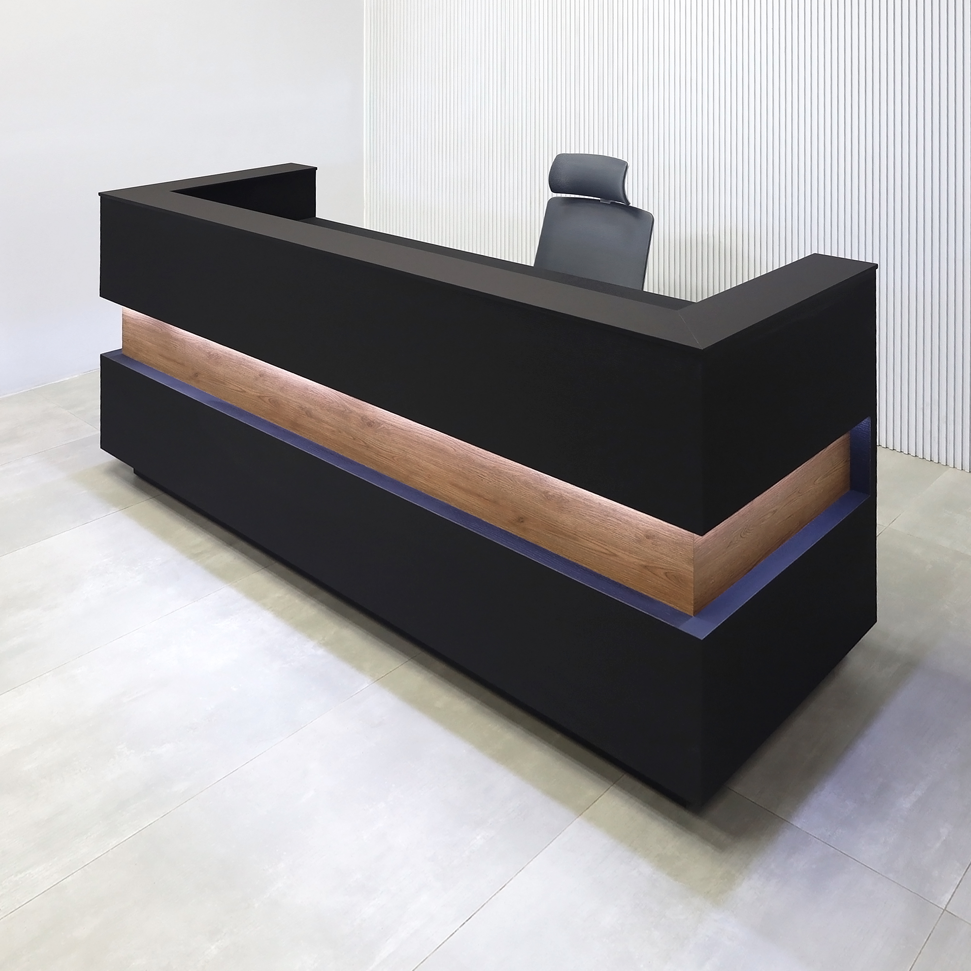 90-inch Pensacola Reception Desk with Black Cinder matte laminate desk and toe-kick. Spiced Chestnut laminate accent, Black traceless engineered surface top, and White LED.