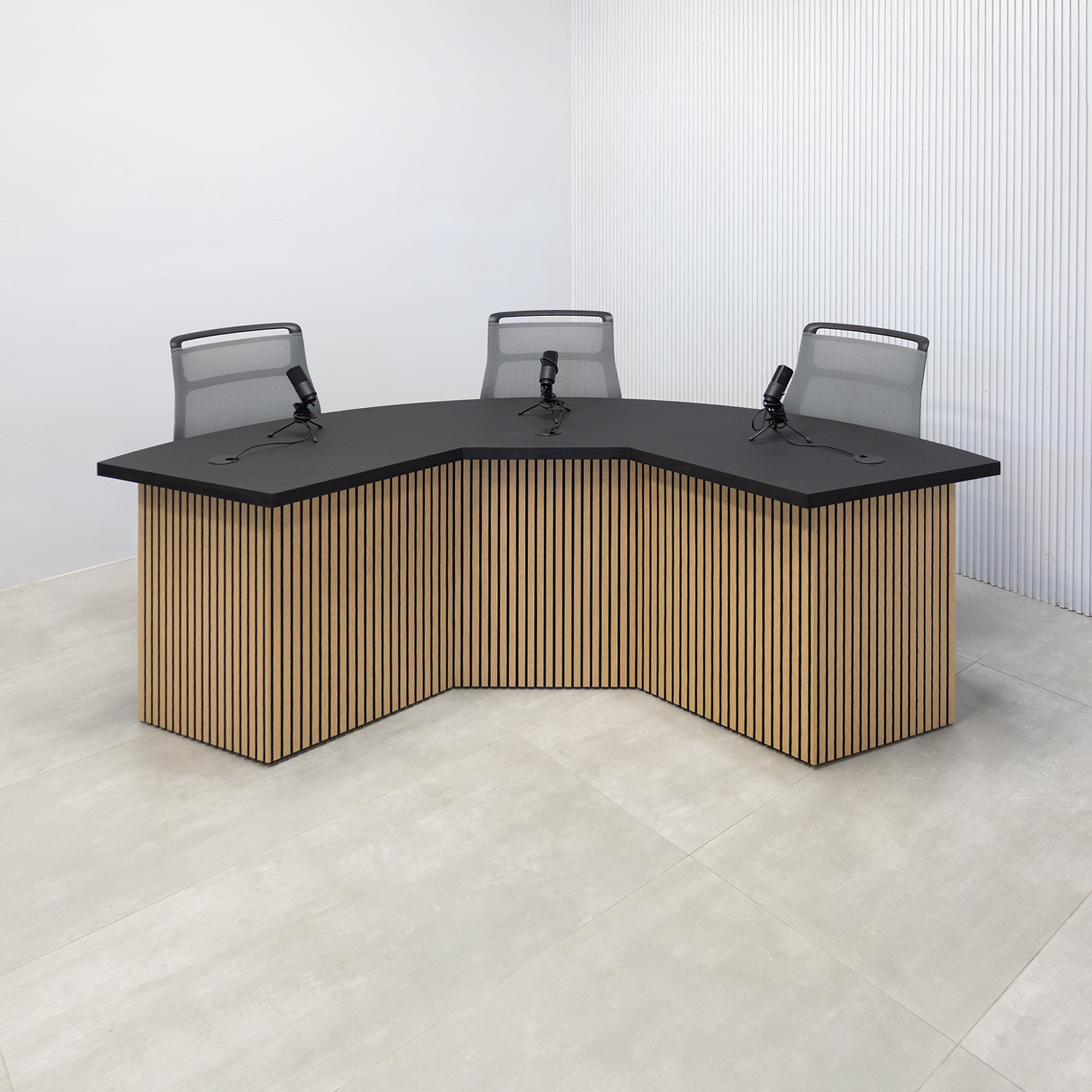 90-inch Tampa Bay Podcast Table with Black Cider matte laminate top, White Oak tambour & Black background front base, Black matte laminate back base. 
