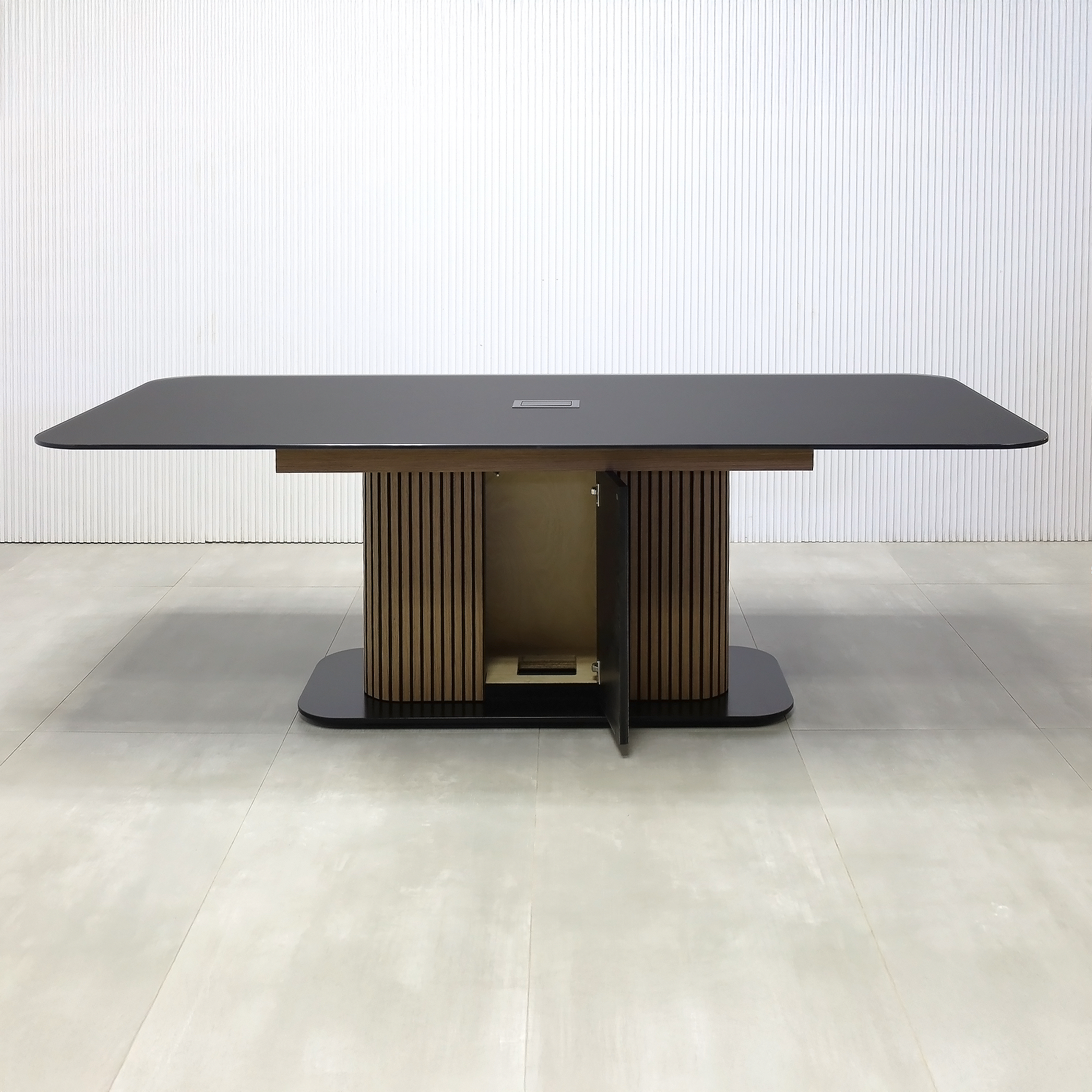 90-inch Omaha Racetrack Conference Table with X3 Base with Black Satin tempered glass top, Spiced Walnut & Black background tambour pedestal, Black powder coated base, and Mx2 power box.