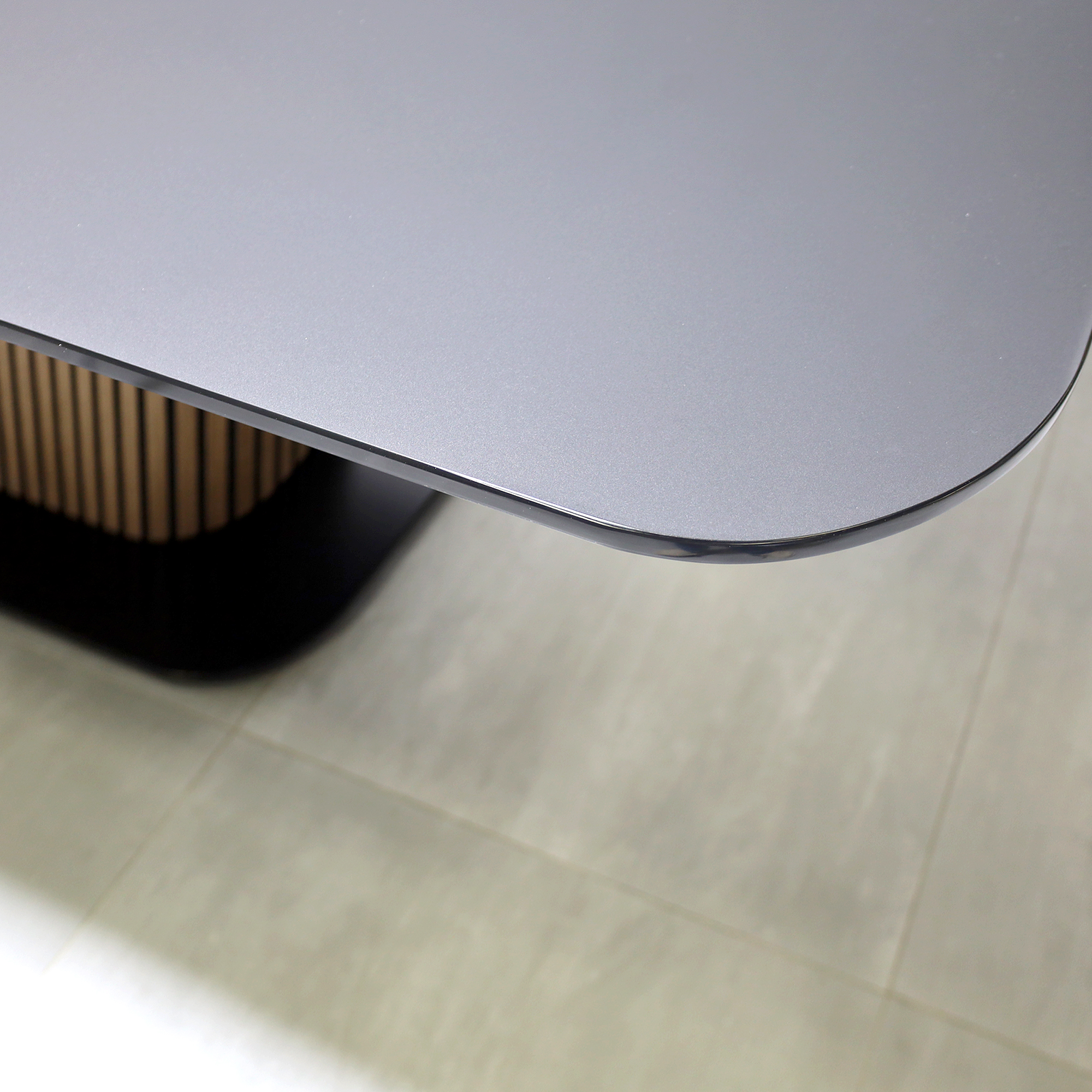 90-inch Omaha Racetrack Conference Table with X3 Base with Black Satin tempered glass top, Spiced Walnut & Black background tambour pedestal, Black powder coated base, and Mx2 power box.