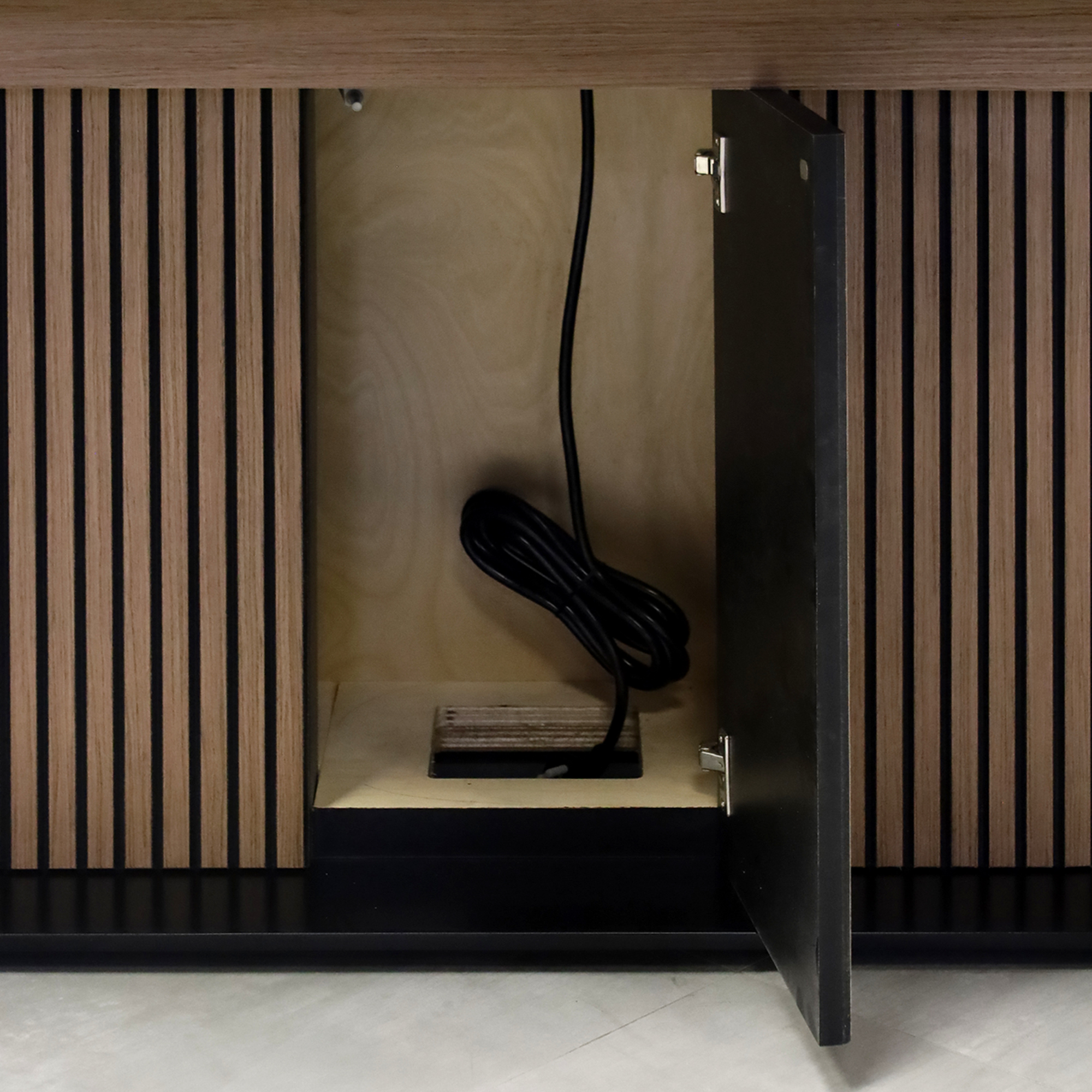 90-inch Omaha Racetrack Conference Table with X3 Base with Black Satin tempered glass top, Spiced Walnut & Black background tambour pedestal, Black powder coated base, and Mx2 power box.