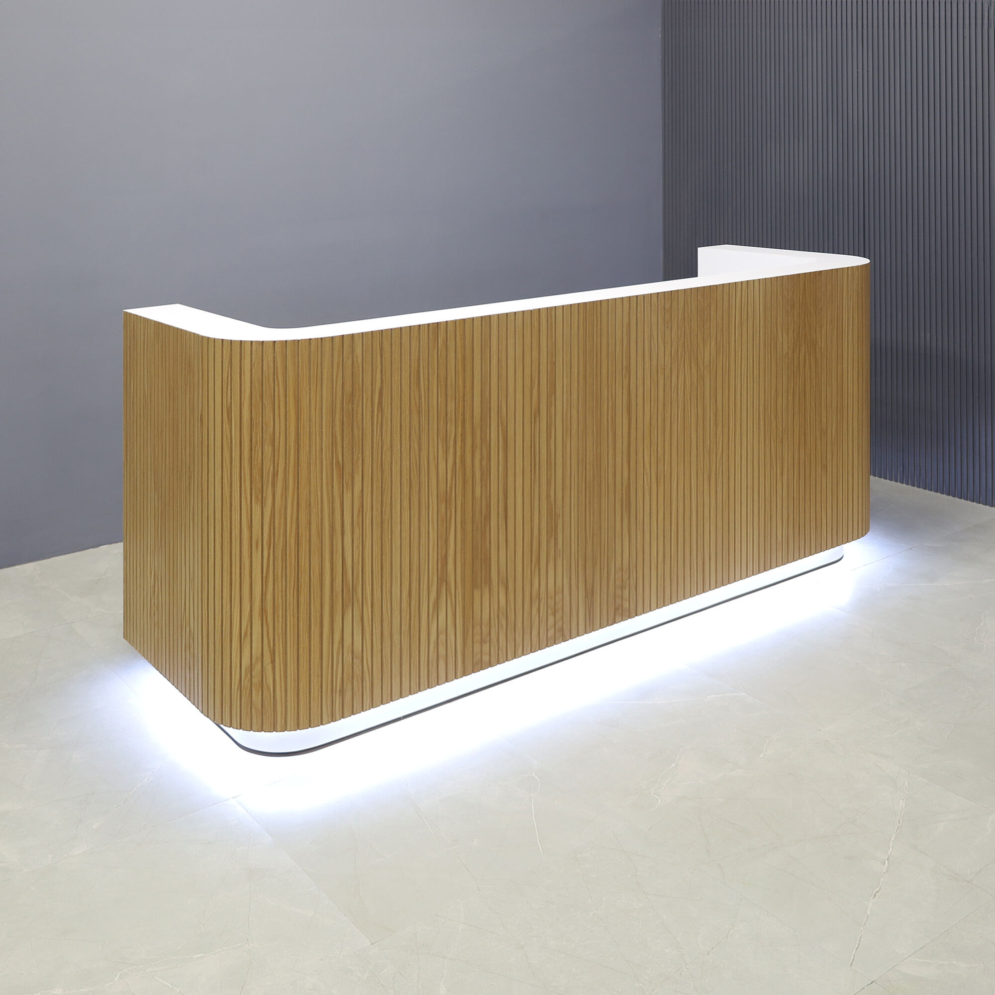 90-inch Nola Custom Reception Desk black traceless tambour main desk, black PVC stone laminate workspace, gold aluminum toe-kick, and warm white LED. 