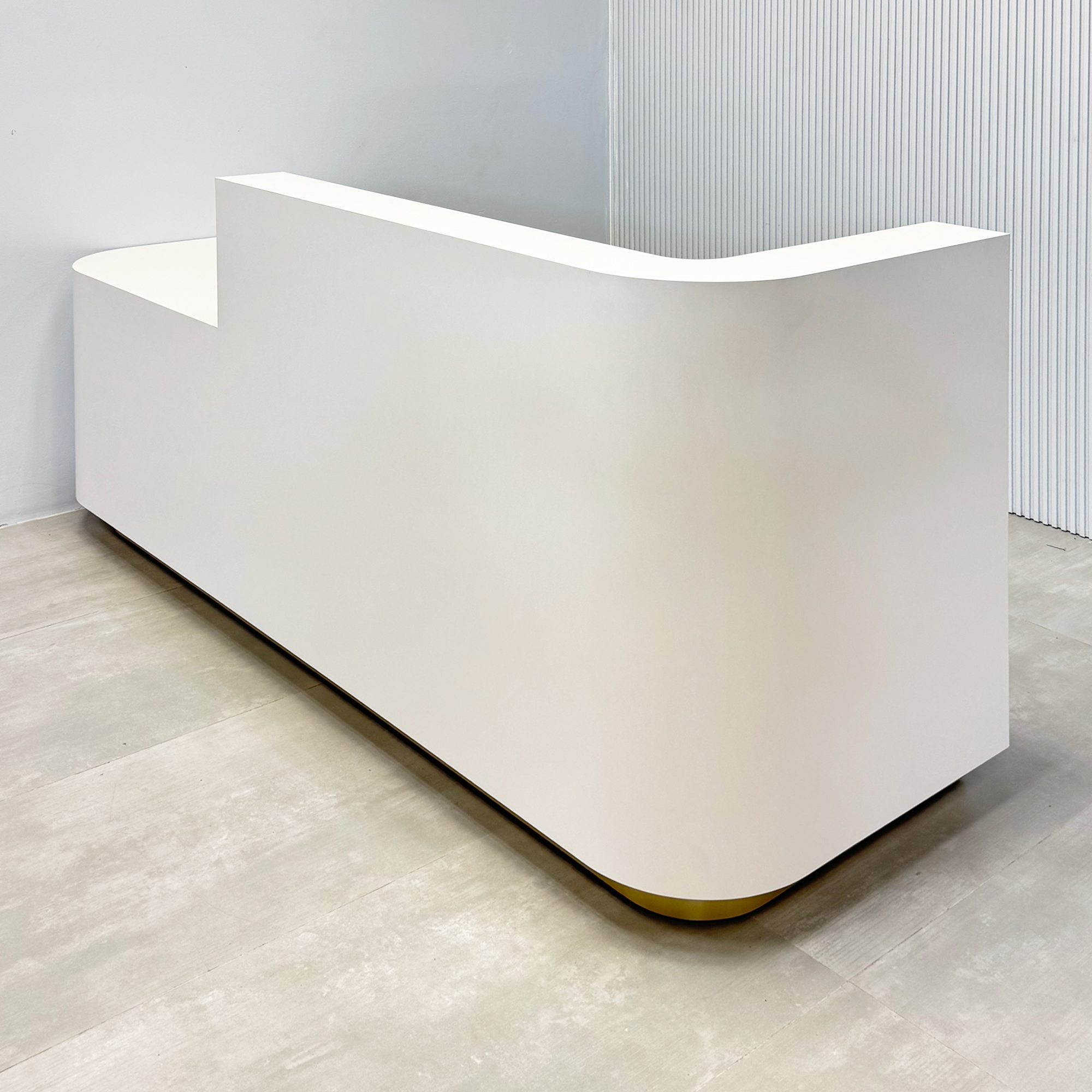 90-inch Nola Low Counter Reception Desk with white matte laminate workspace, white matte laminate desk, and brushed gold aluminum toe-kick.