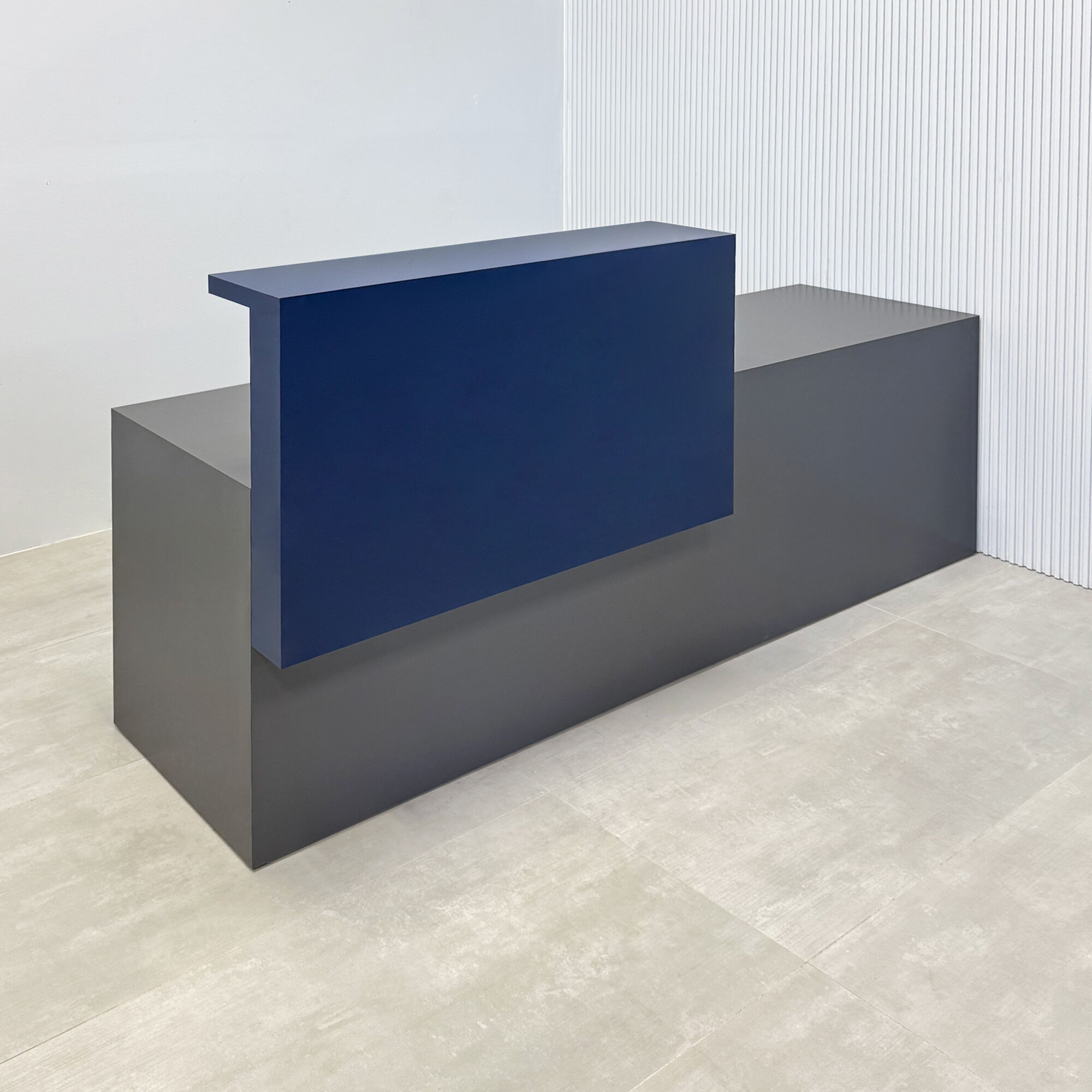 90-inch Los Angeles Custom Reception Desk in navy blue matte laminate counter, storm gray matte laminate desk, and warm white LED.