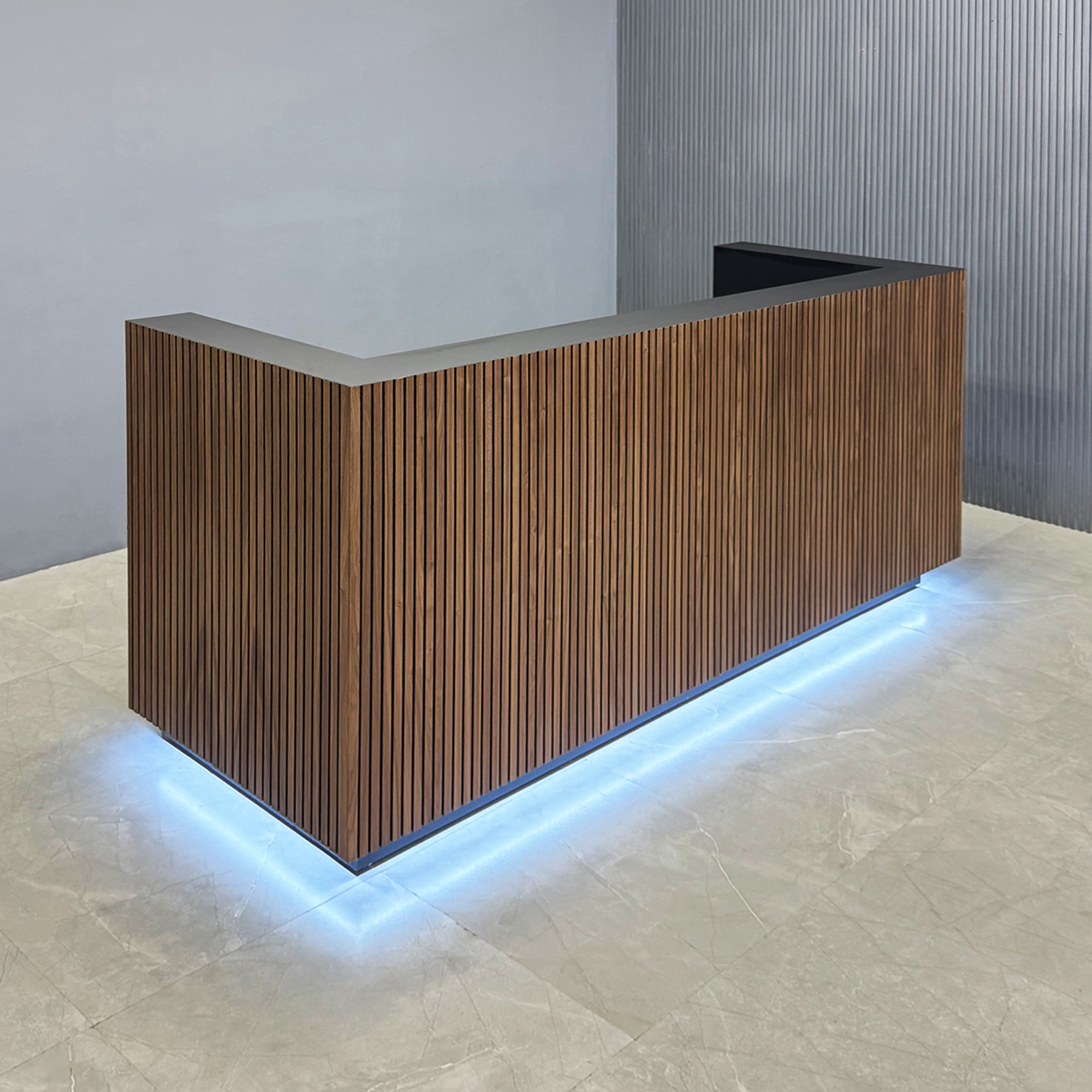 90-inch Dallas U-Shape Reception Desk in walnut tambour main desk and black traceless laminate workspace and toe-kick, with color LED, shown here.