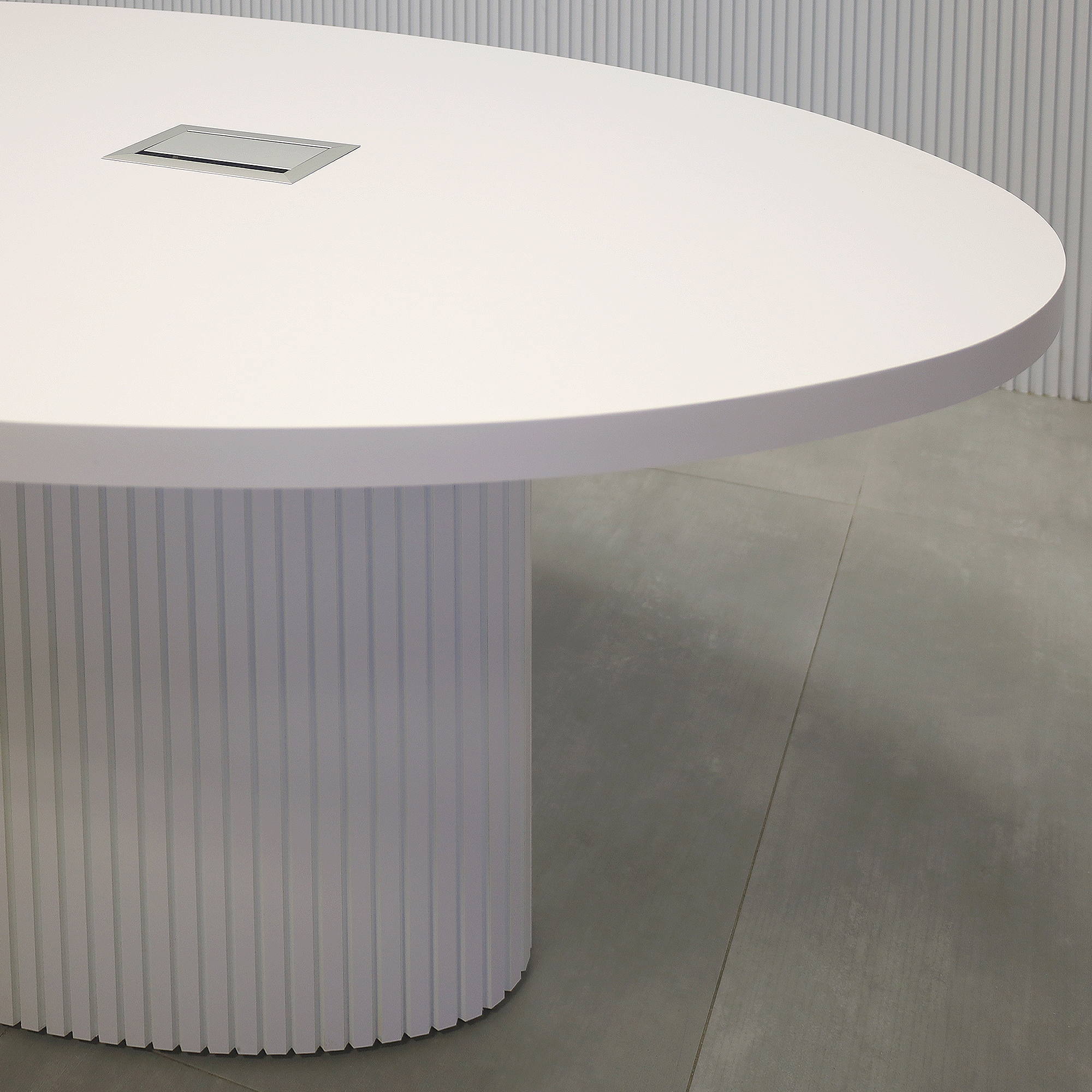 90-inch Newton Oval Conference Table with White Matte laminate top, White Matte tambour base, and Mx3 in Silver.