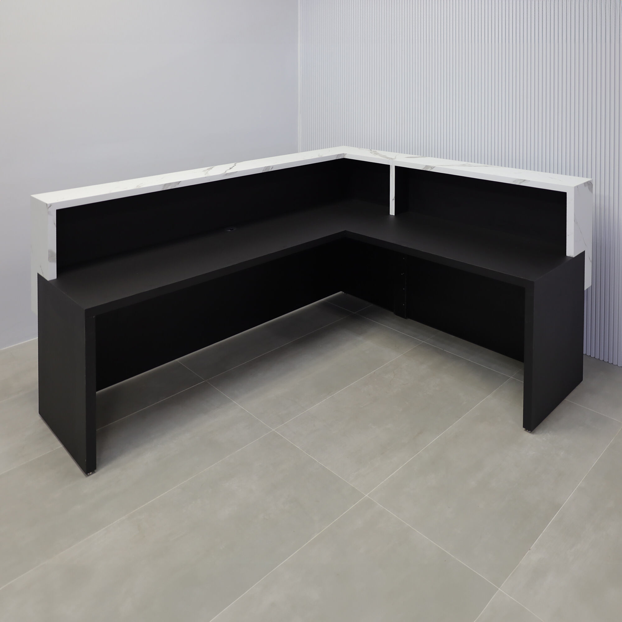 90-inch San Francisco L-Shape Reception Desk with black traceless laminate desk, calcutta stone PVC laminate counter, black traceless laminate workspace, white LED.