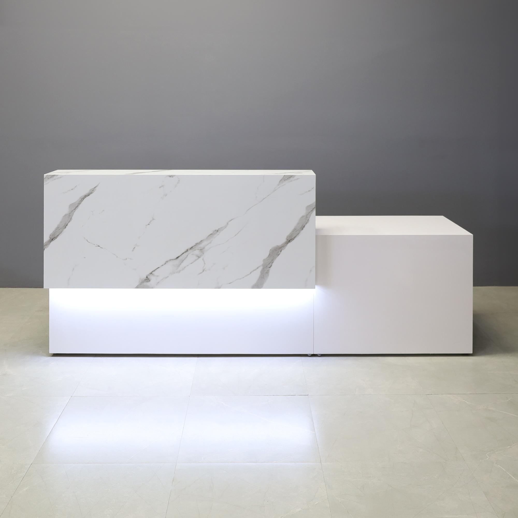 Los Angeles Long and ADA Compliant Custom Reception Desk in calcutta stone pvc laminate counter and white matte laminate desk, with warm white LED shown here.
