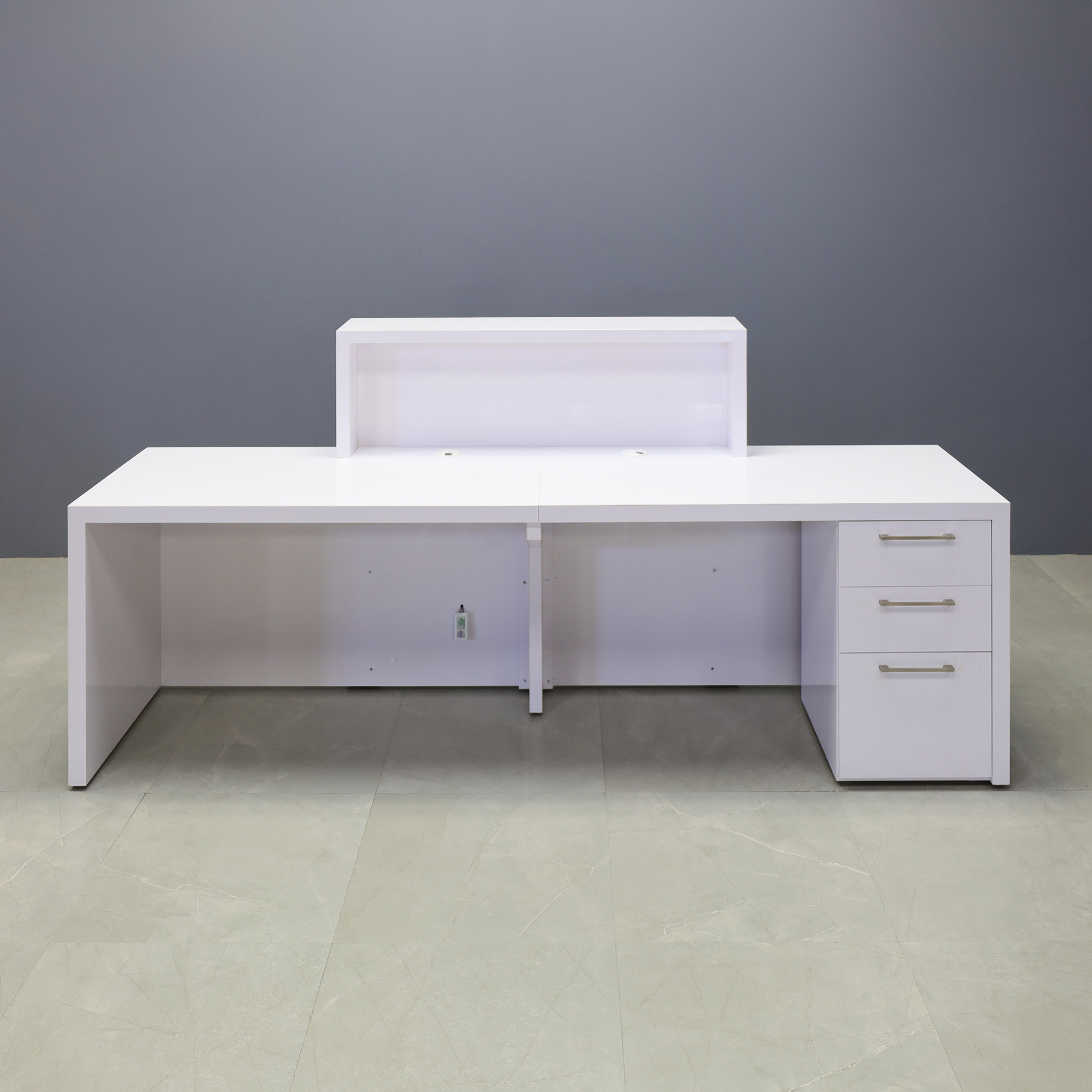 96-inch New York Extra Wide in white gloss laminate main desk & front panel, uptown walnut (discontinued) matte laminate accent recessed, and color changing LED. Built-in storage on the right side when sitting.