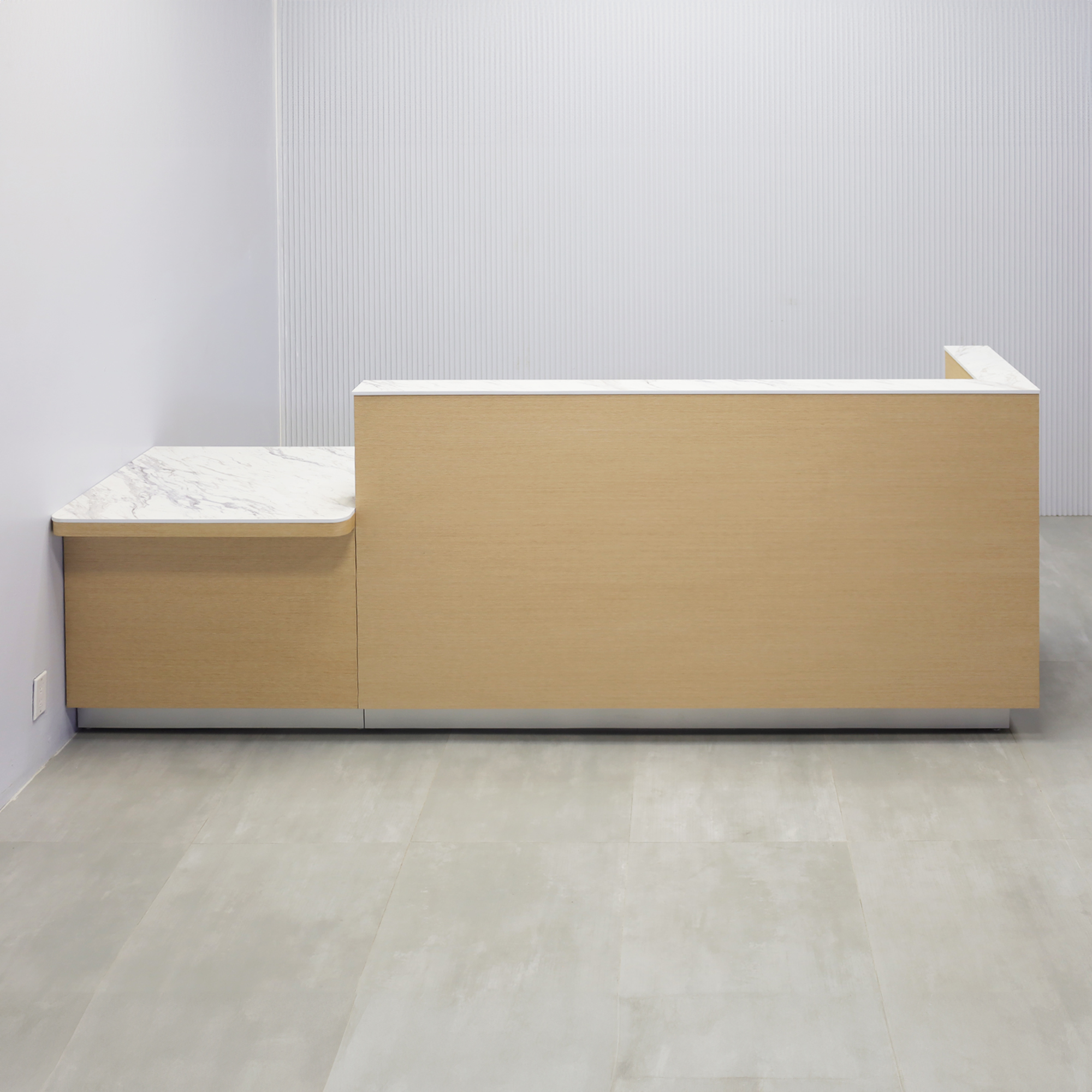 Dallas ADA Compliant Counter Custom Reception Desk with Calcutta Stone PVC workspace, White Oak Veneer body finish, and Brushed Aluminum toe-kick.