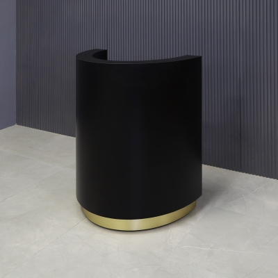 32-inch Lima Round Podium & Host Custom Desk in black matte laminate desk and gold aluminum toe-kick, shown here.