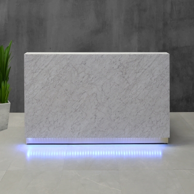 72-inch Dallas Straight Custom Reception Desk in carrara laminate (discontinued) main desk and brushed gold aluminum toe-kick, with multi-colored LED, shown here.